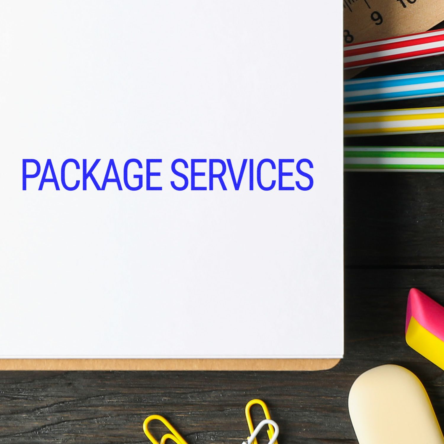 Package services concept with PACKAGE SERVICES text on paper beside shipping supplies and labels, highlighting logistics support