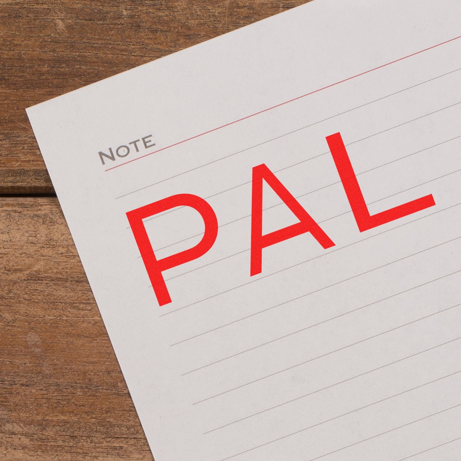 Word FAIL stamped in red on a note paper labeled NOTE, highlighting a failure or error reminder.