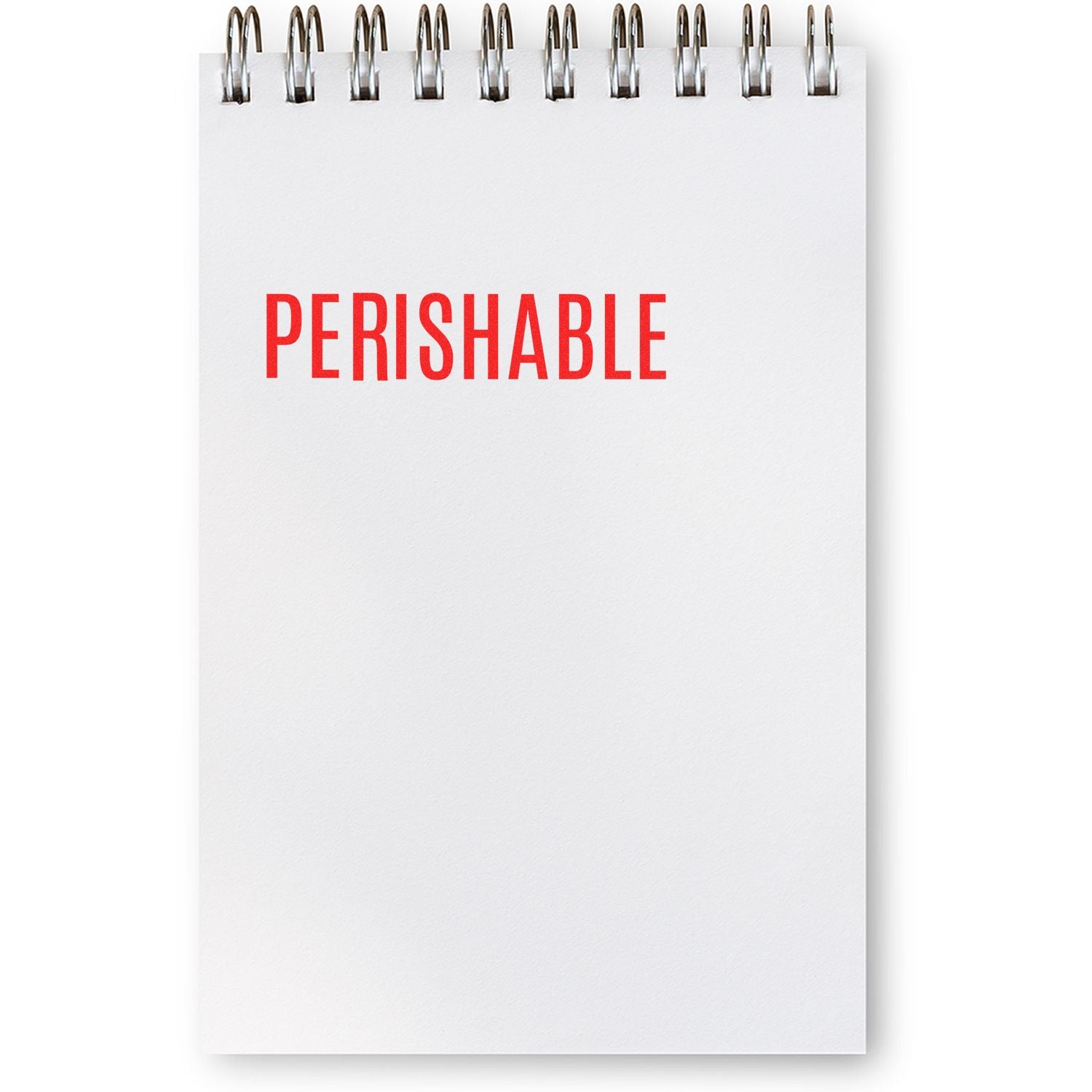 Blank spiral notebook page with red PERISHABLE text on white background, minimal office concept.