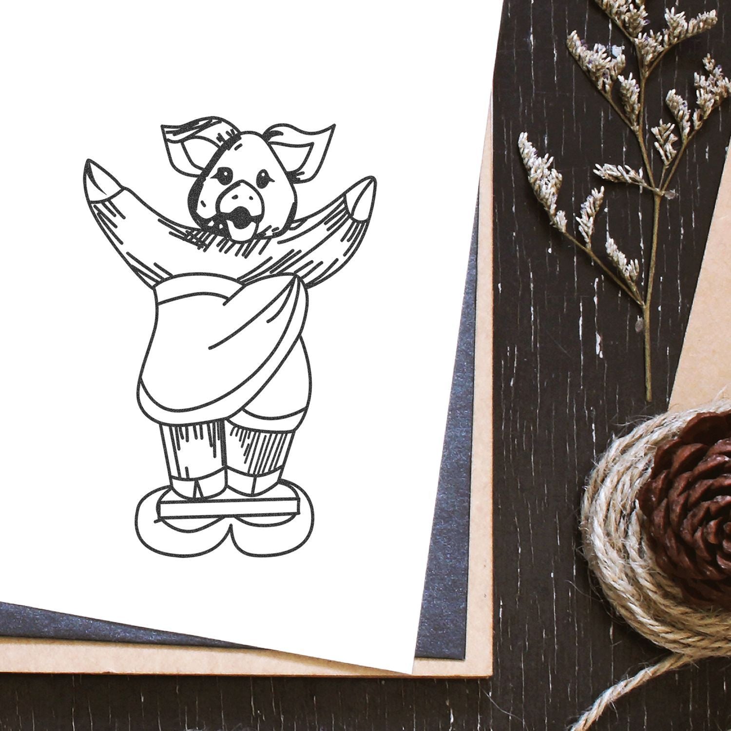 Cute pig in sweater illustration on rustic wooden table with pinecone and dried flowers.