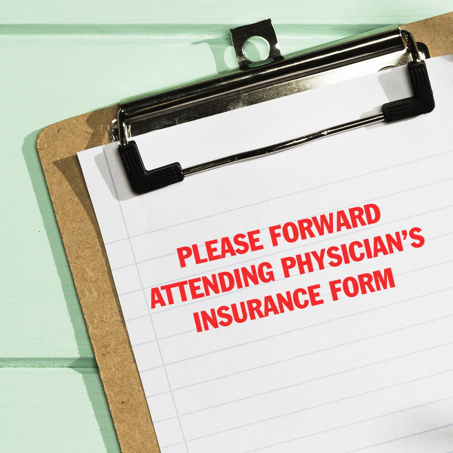 Clipboard with attending physician insurance form for medical claims and patient paperwork handling.