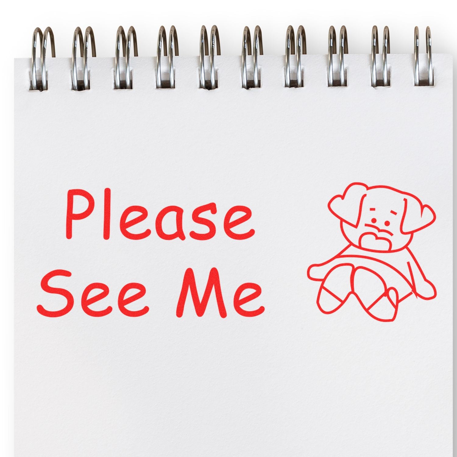 Office desk sign reading Please See Me in red letters with bear icon, attached by metal binder rings for visitors