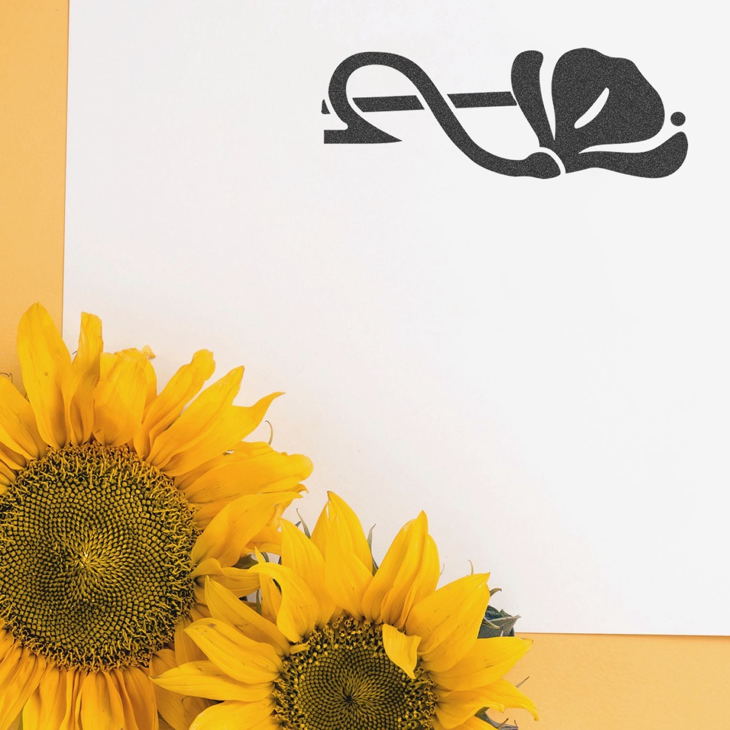 Bright yellow sunflowers with elegant black Arabic calligraphy on a white and yellow background.