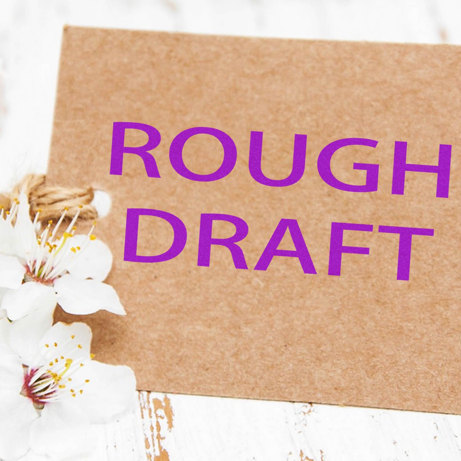 Rough draft text on kraft paper with white flowers, creative stationery mockup background