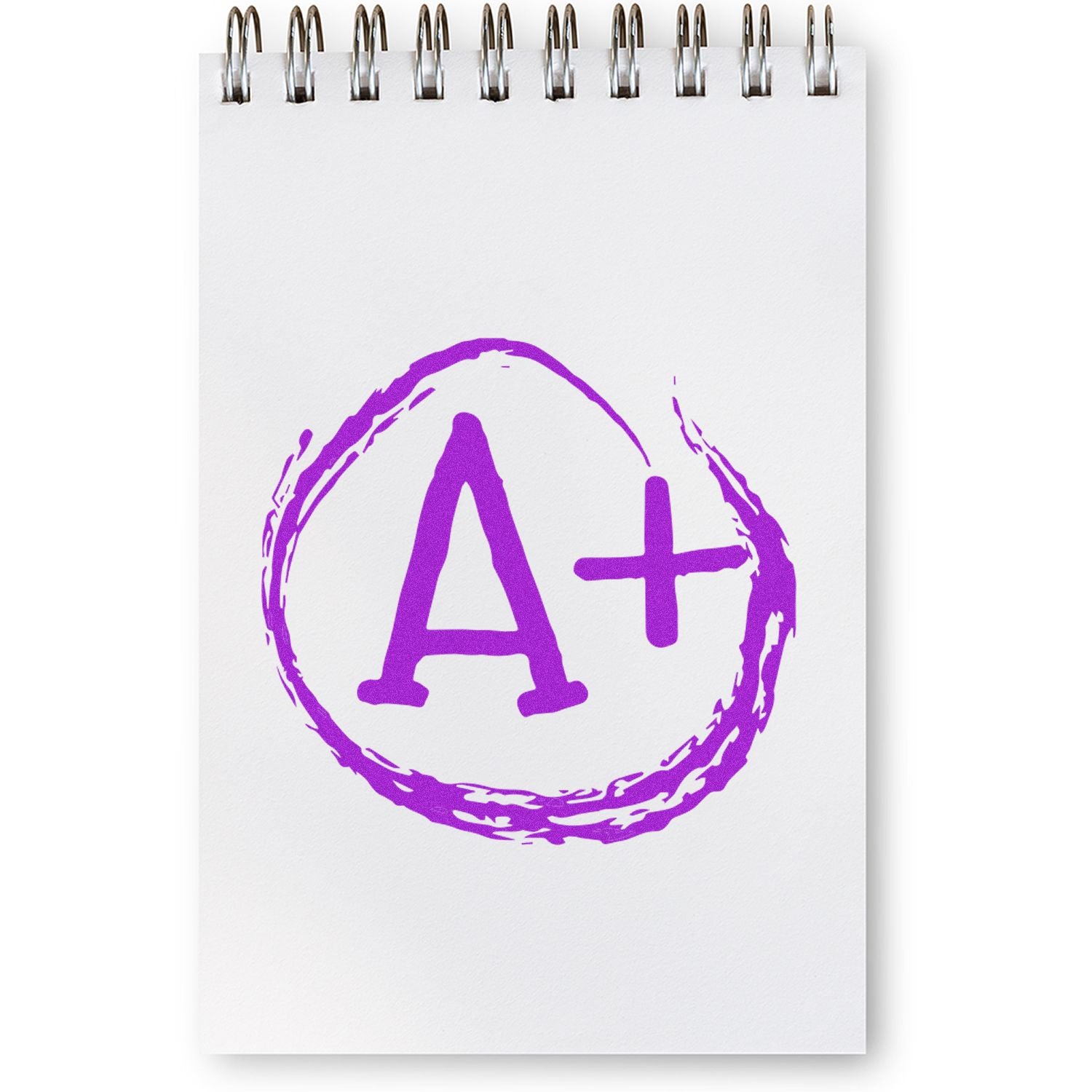 Purple A+ grade symbol on a white spiral notebook, education achievement concept.