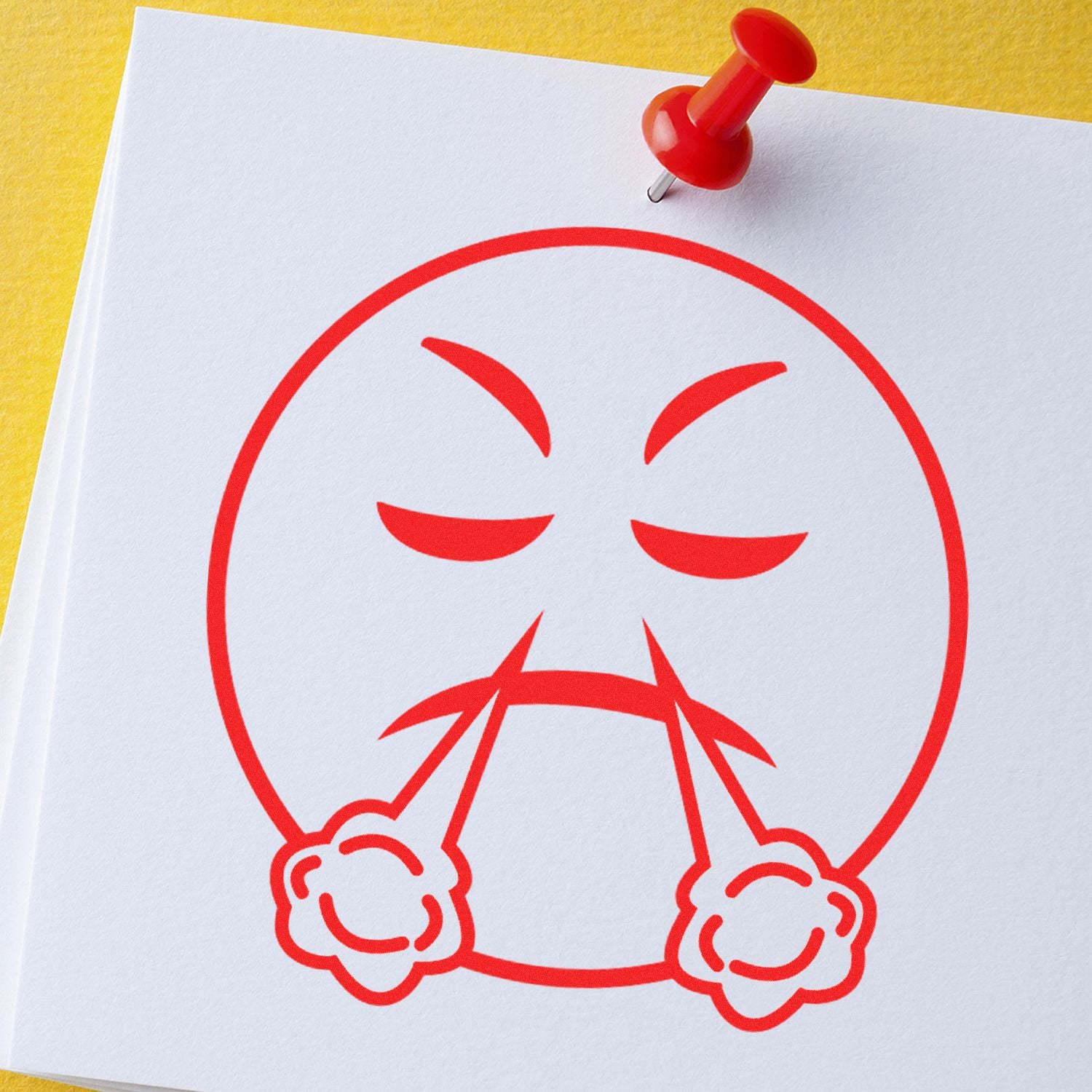Angry cartoon face icon on pinned white paper, red pushpin on yellow background