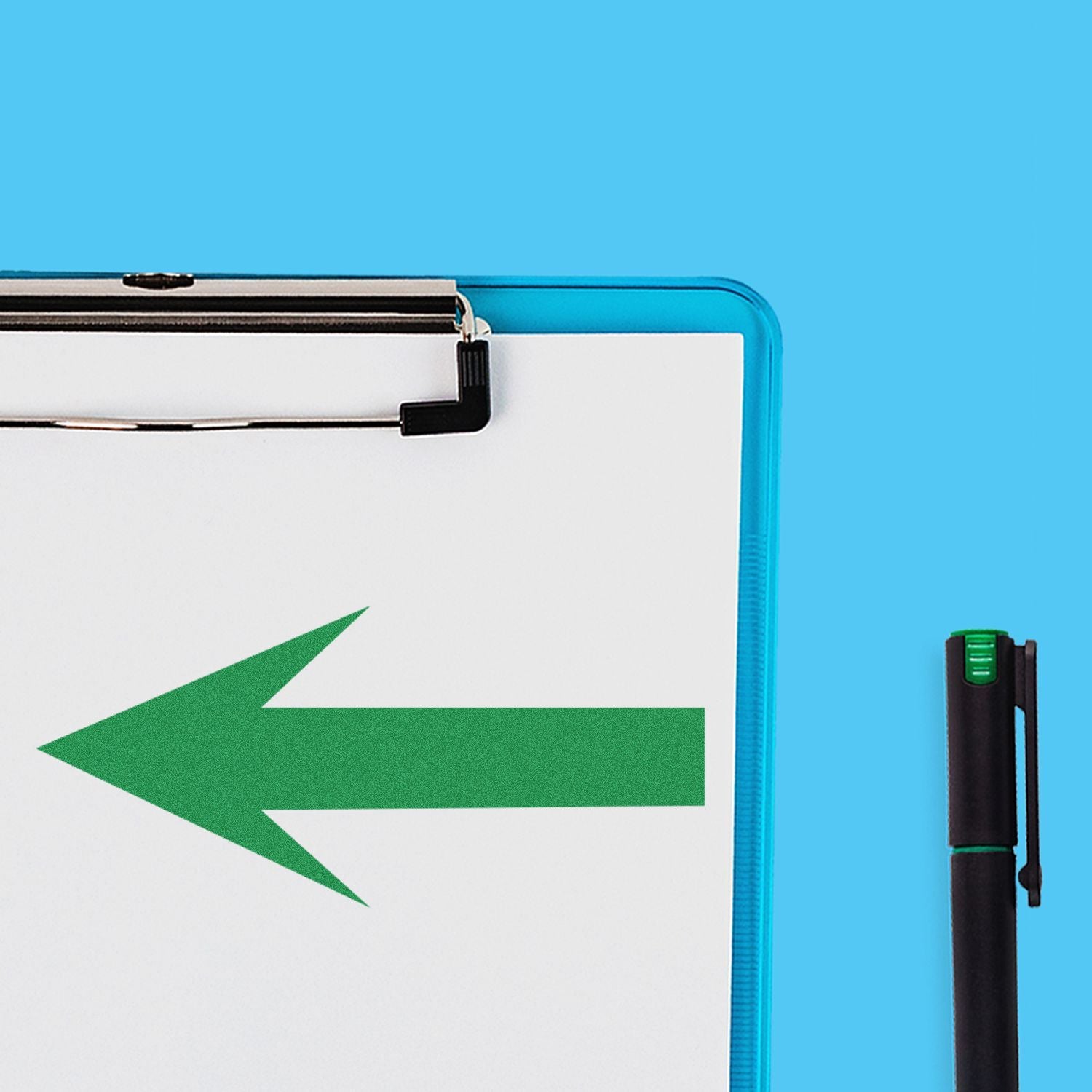 Blue-framed clipboard with green left arrow on white paper and marker pen on blue background