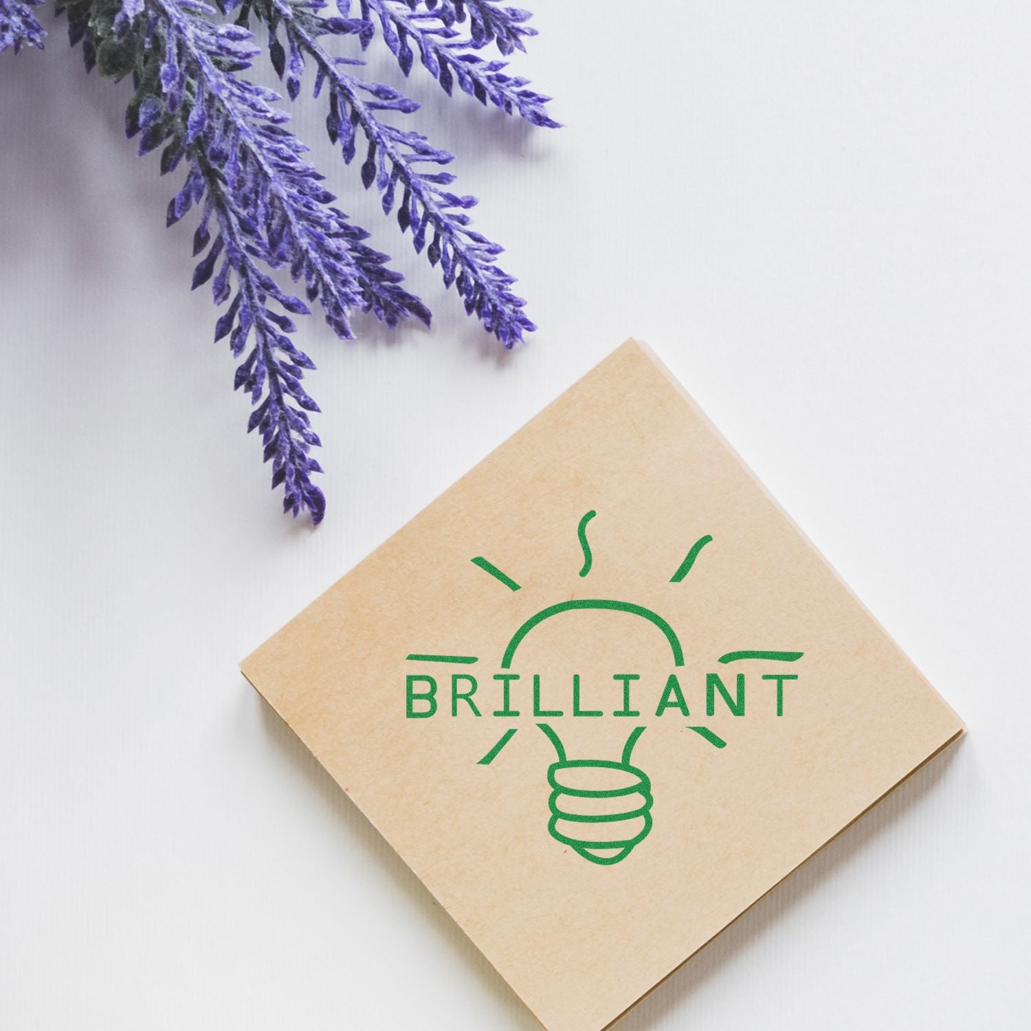 Brilliant eco-friendly branding card with green lightbulb logo and purple lavender on a white background