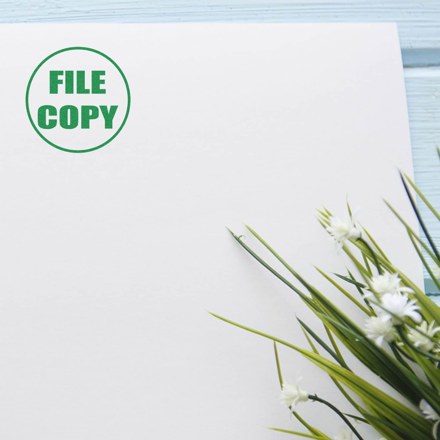 Blank file copy document with green stamp on white paper and floral decoration edge