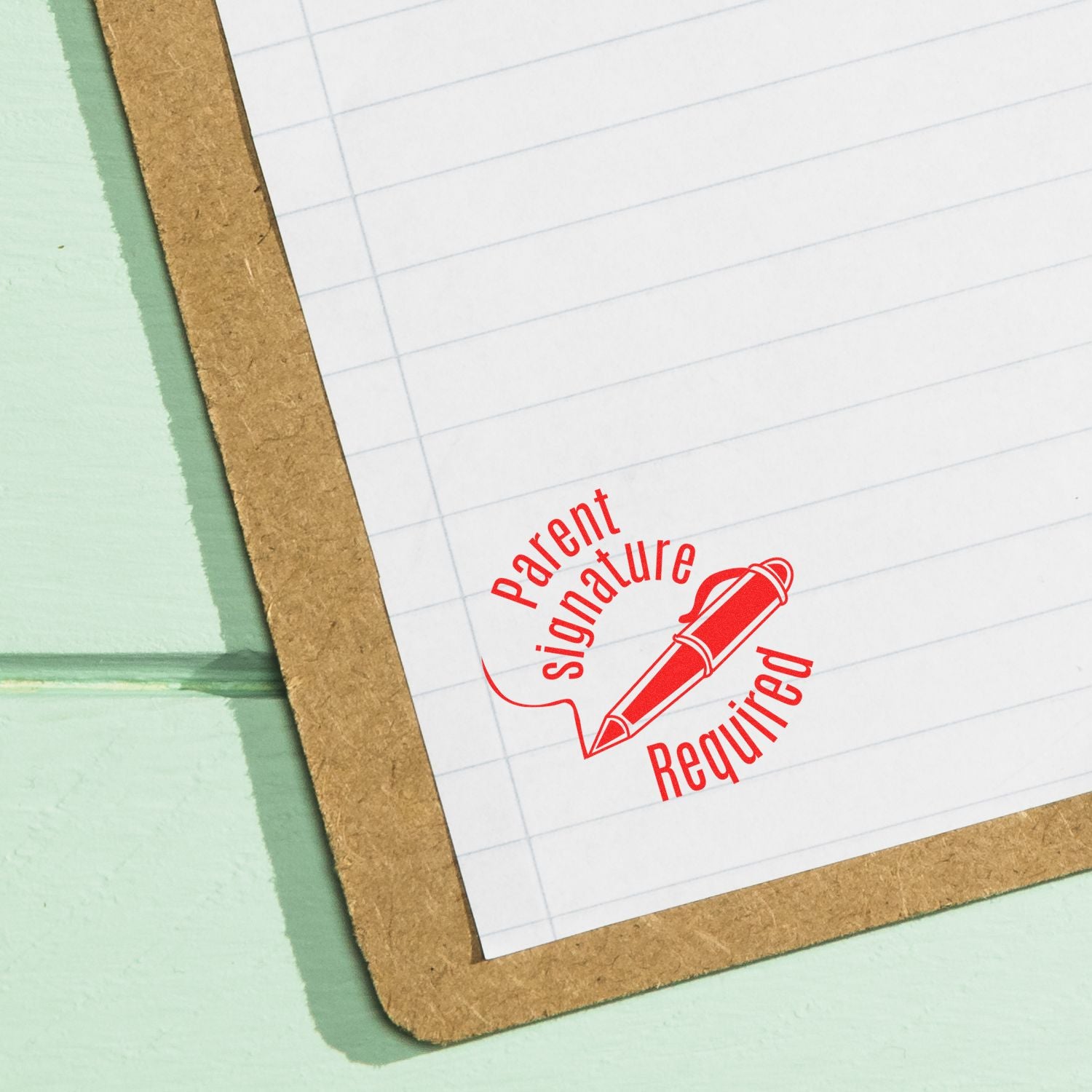 Close-up of a school form on a clipboard with a red Parent Signature Required stamp.