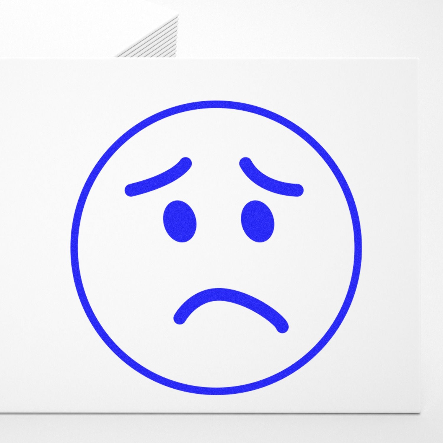 Blue sad face emoji icon on a white background, simple emotional symbol illustration