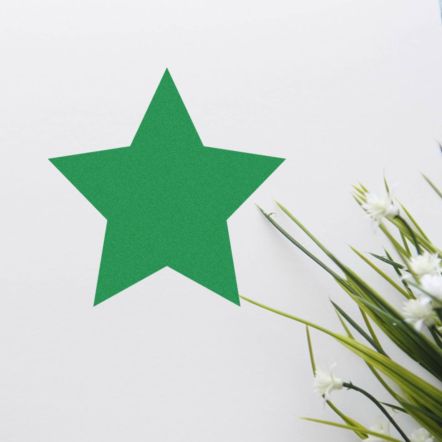 Green star cutout on a white background with decorative white flowers and green leaves