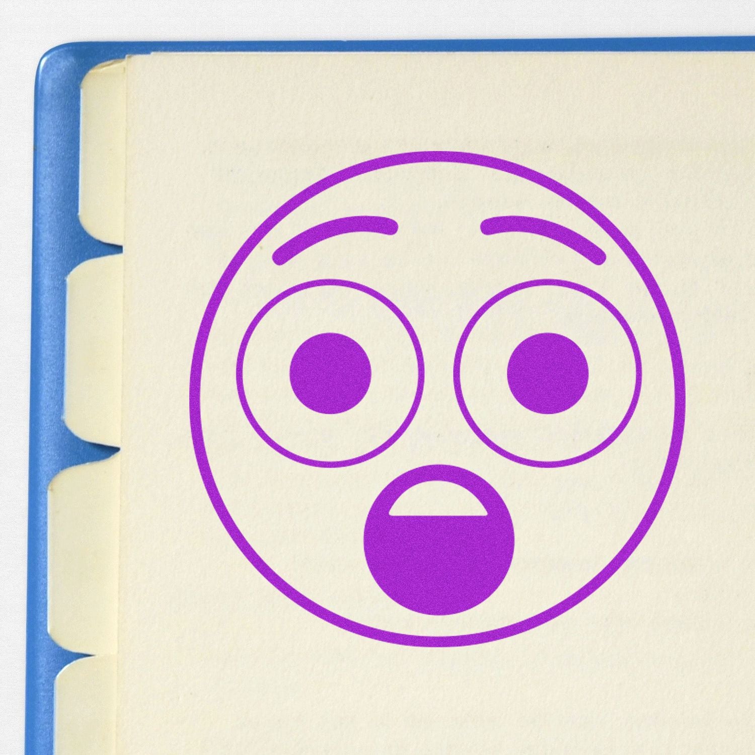Purple shocked emoji icon on a cream notebook page with blue tabs, minimalist stationery design