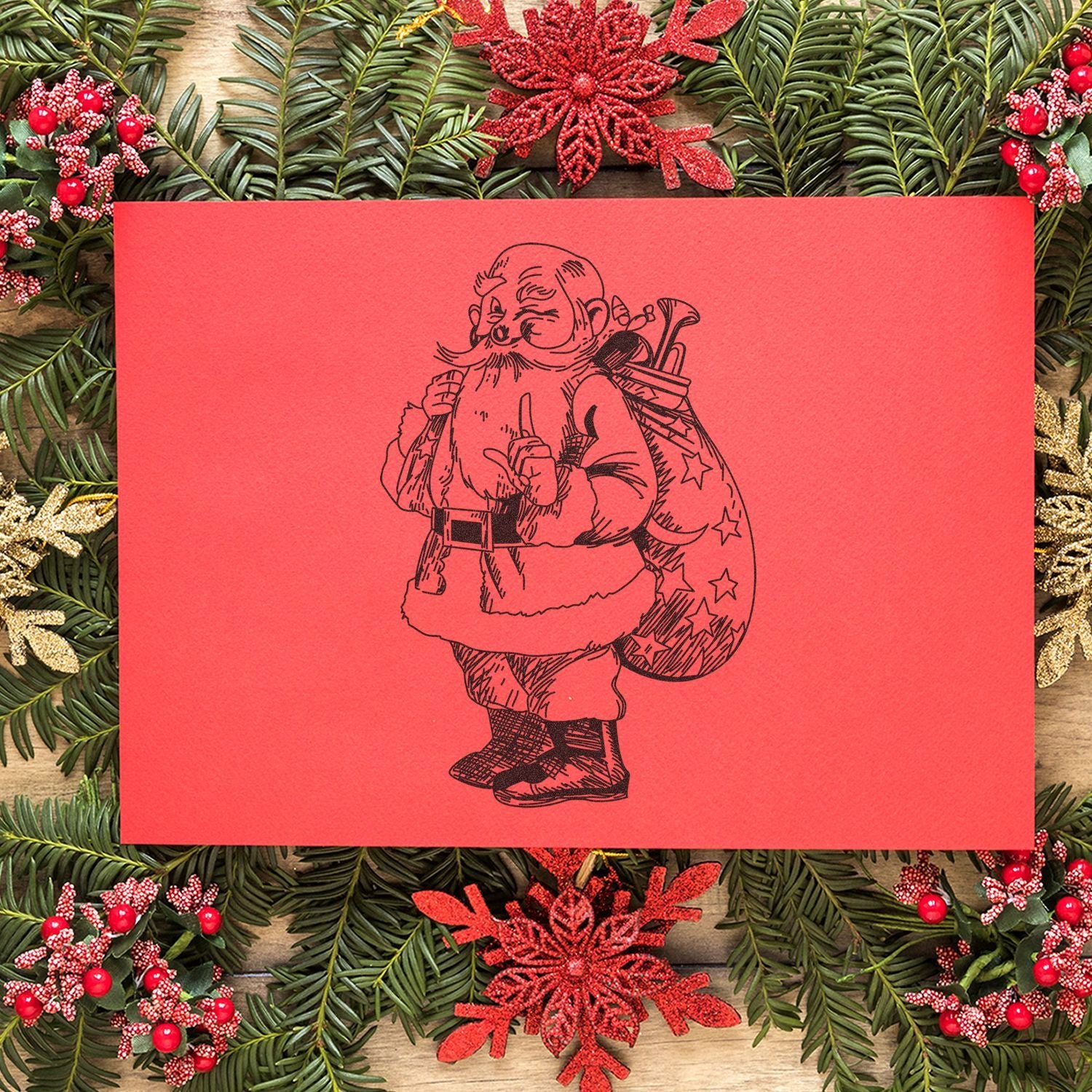 Vintage Santa Claus Christmas card with red background, festive evergreen wreath, and holiday ornaments.