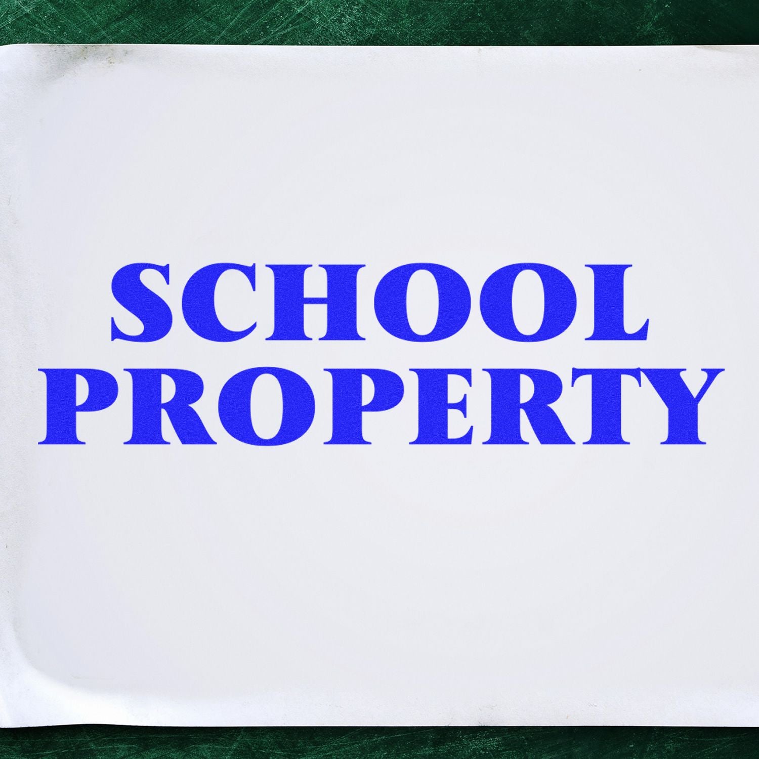 School property label with blue text reading SCHOOL PROPERTY, indicating owned items from a school.
