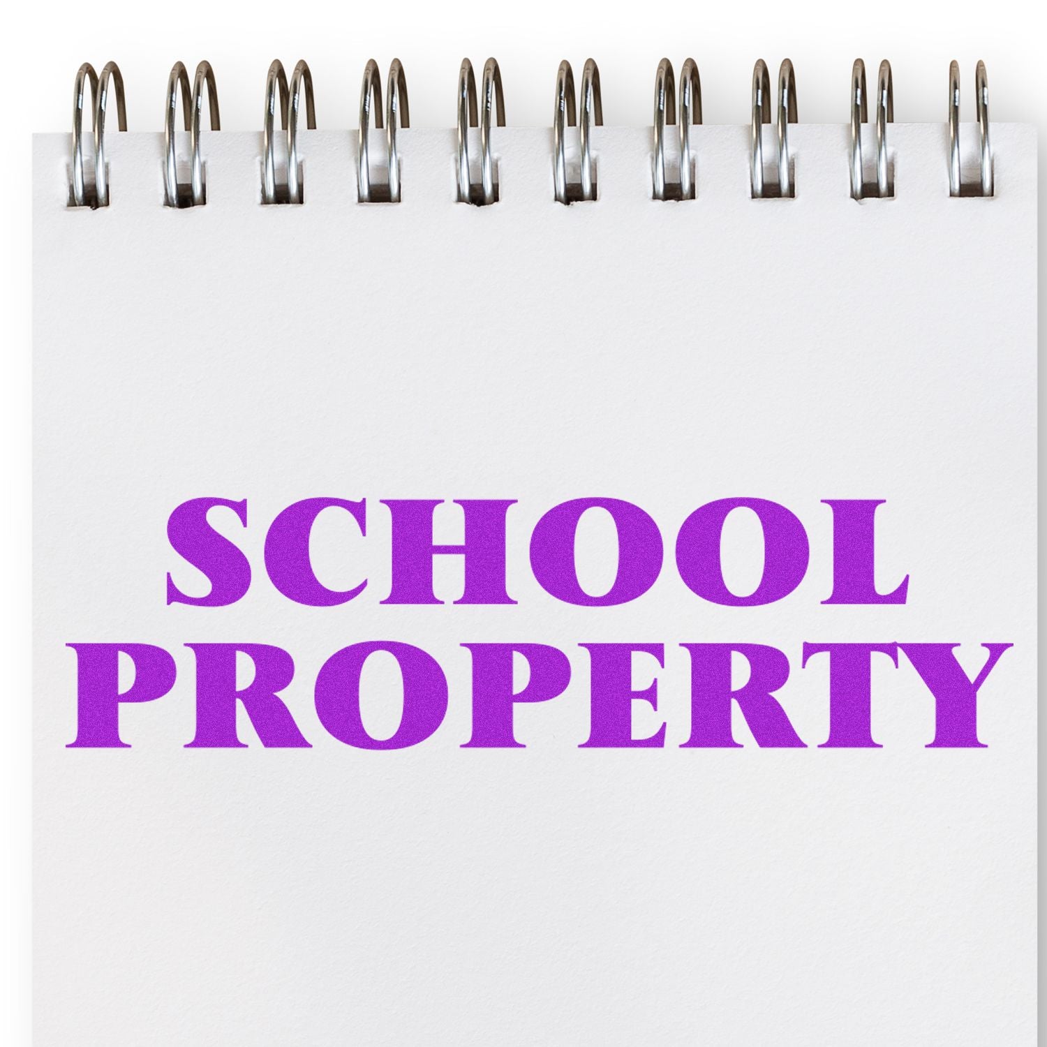 School property sign with purple lettering and metal mounting brackets on white wall for educational building security