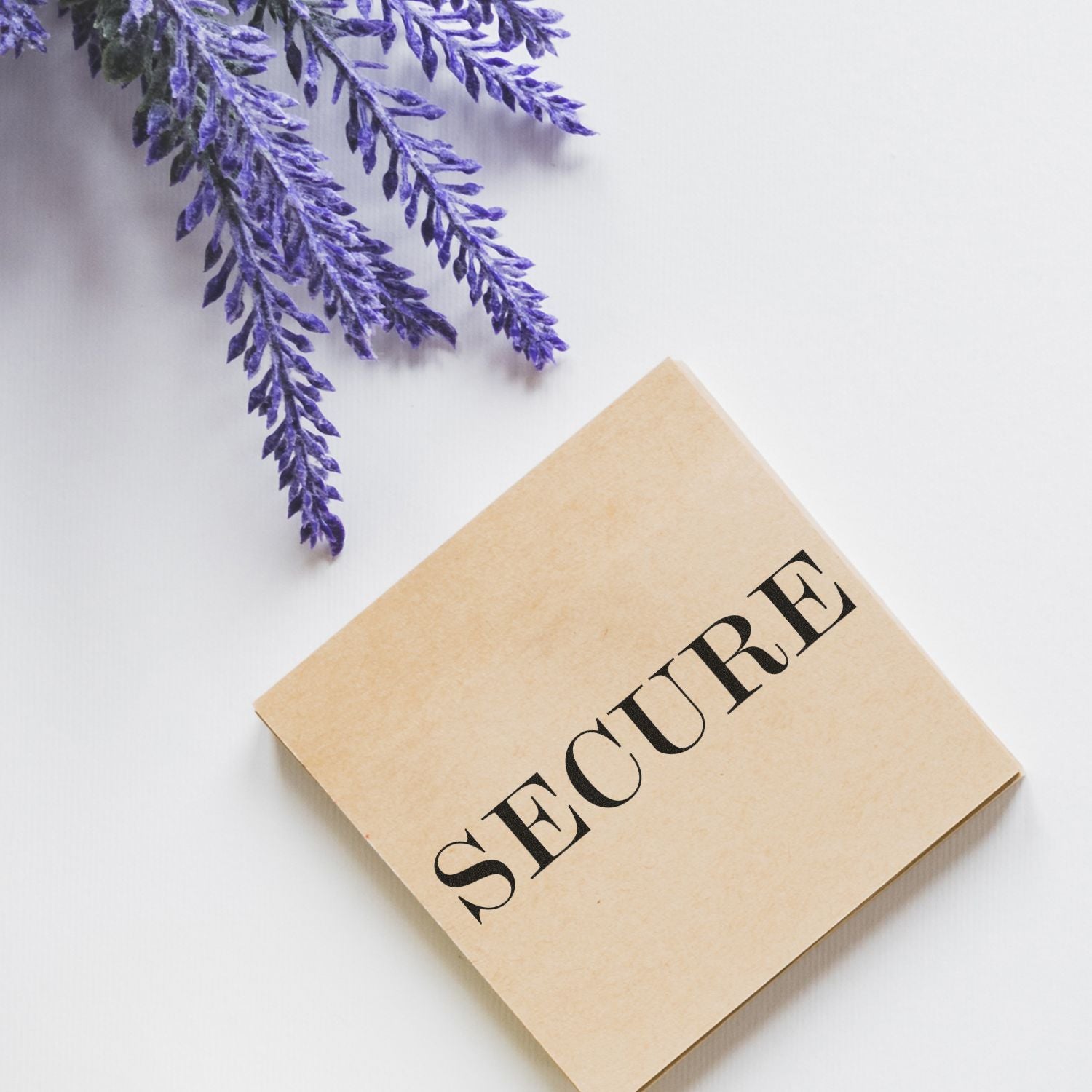 Secure beige box with lavender flowers on a white background, minimal skincare packaging concept