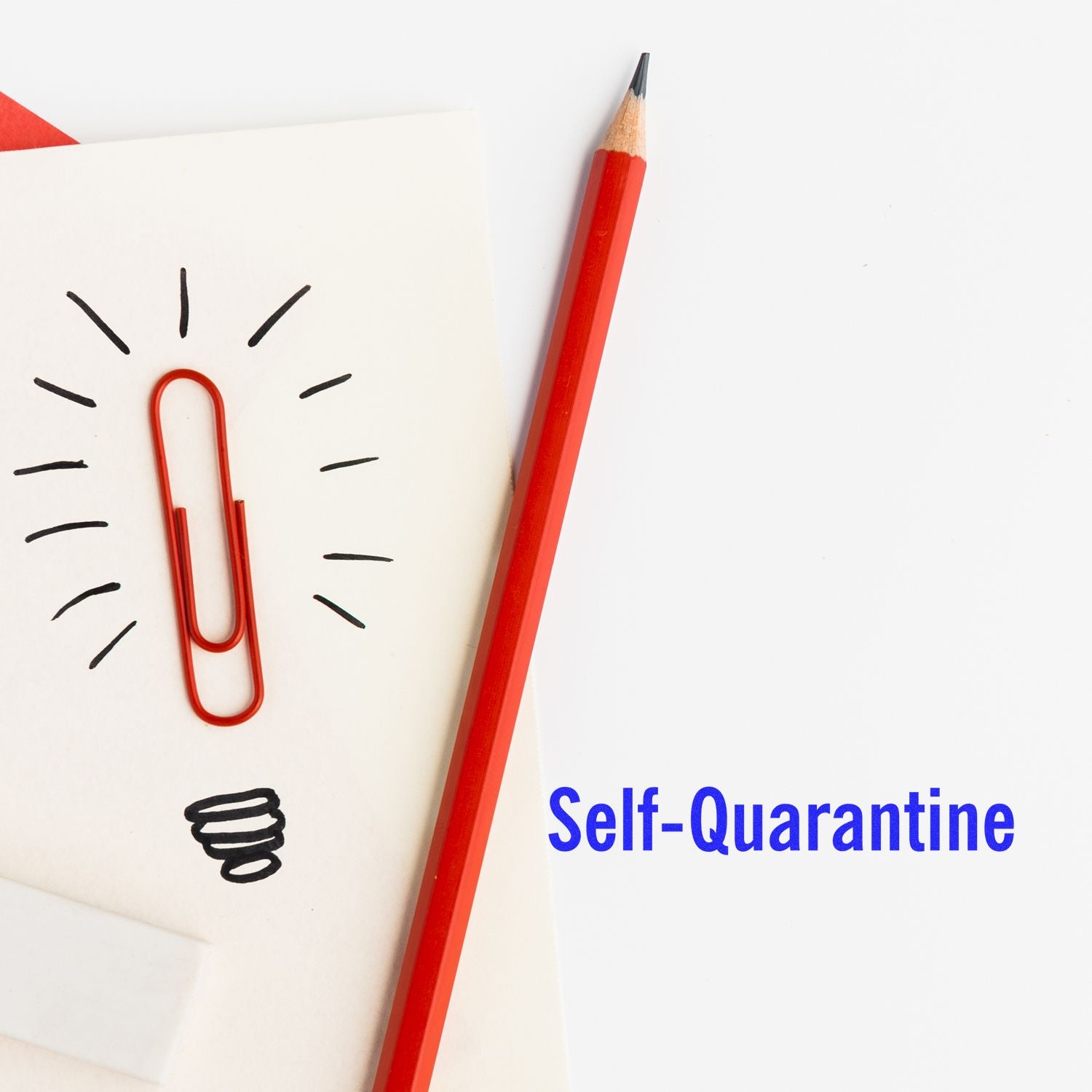 Self-quarantine concept with red pencil, paperclip light bulb drawing, and notebook on white background.