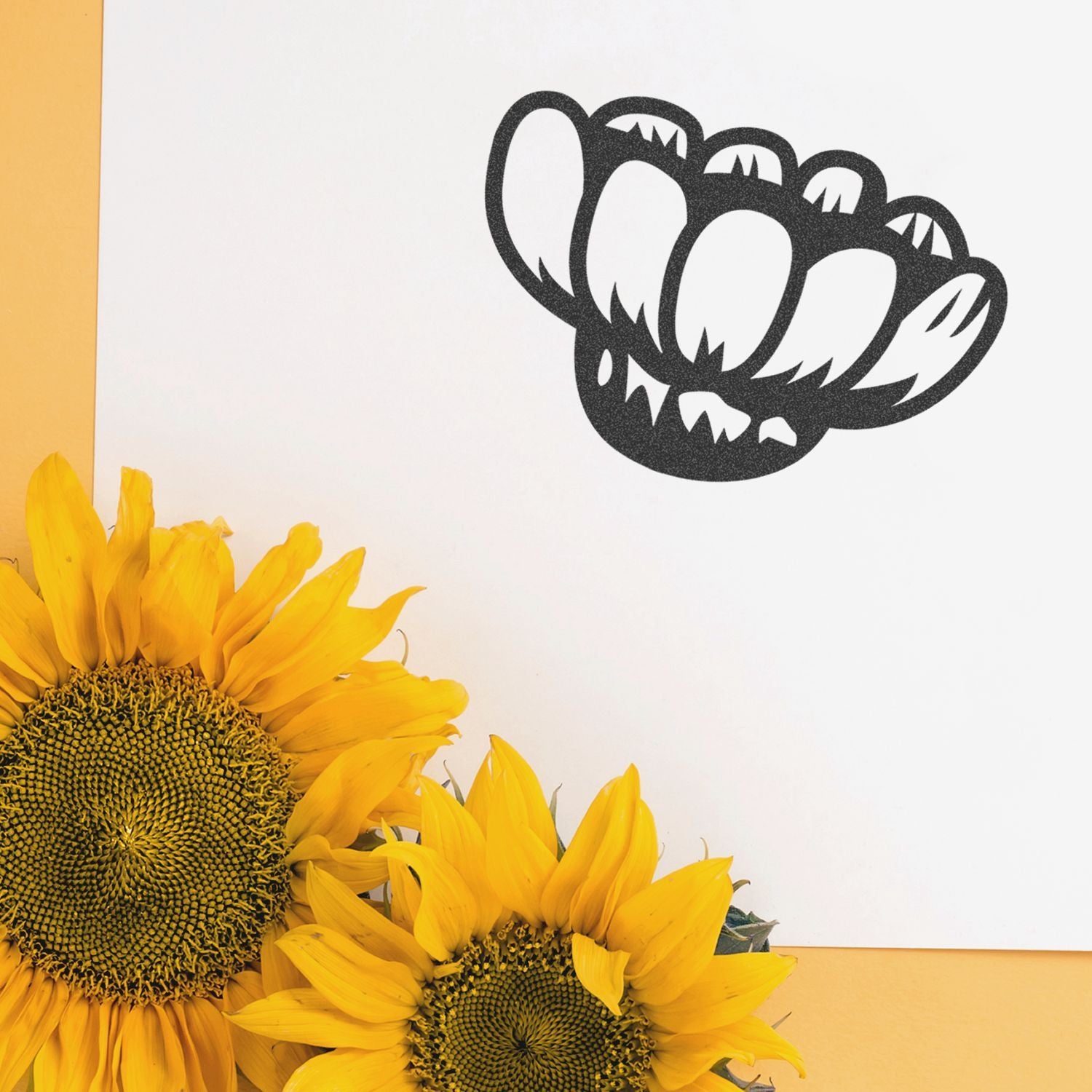 Bright yellow sunflowers with a black floral graphic on a clean white background, creating a vibrant modern floral design.