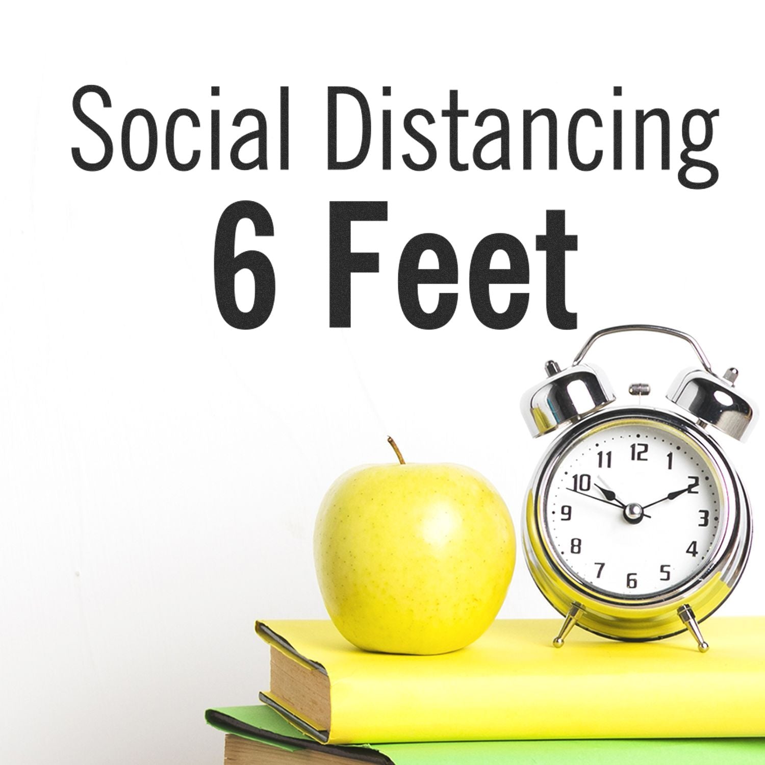 Social distancing 6 feet sign with apple and alarm clock on books, illustrating safe distance and healthy back-to-school safety concept.