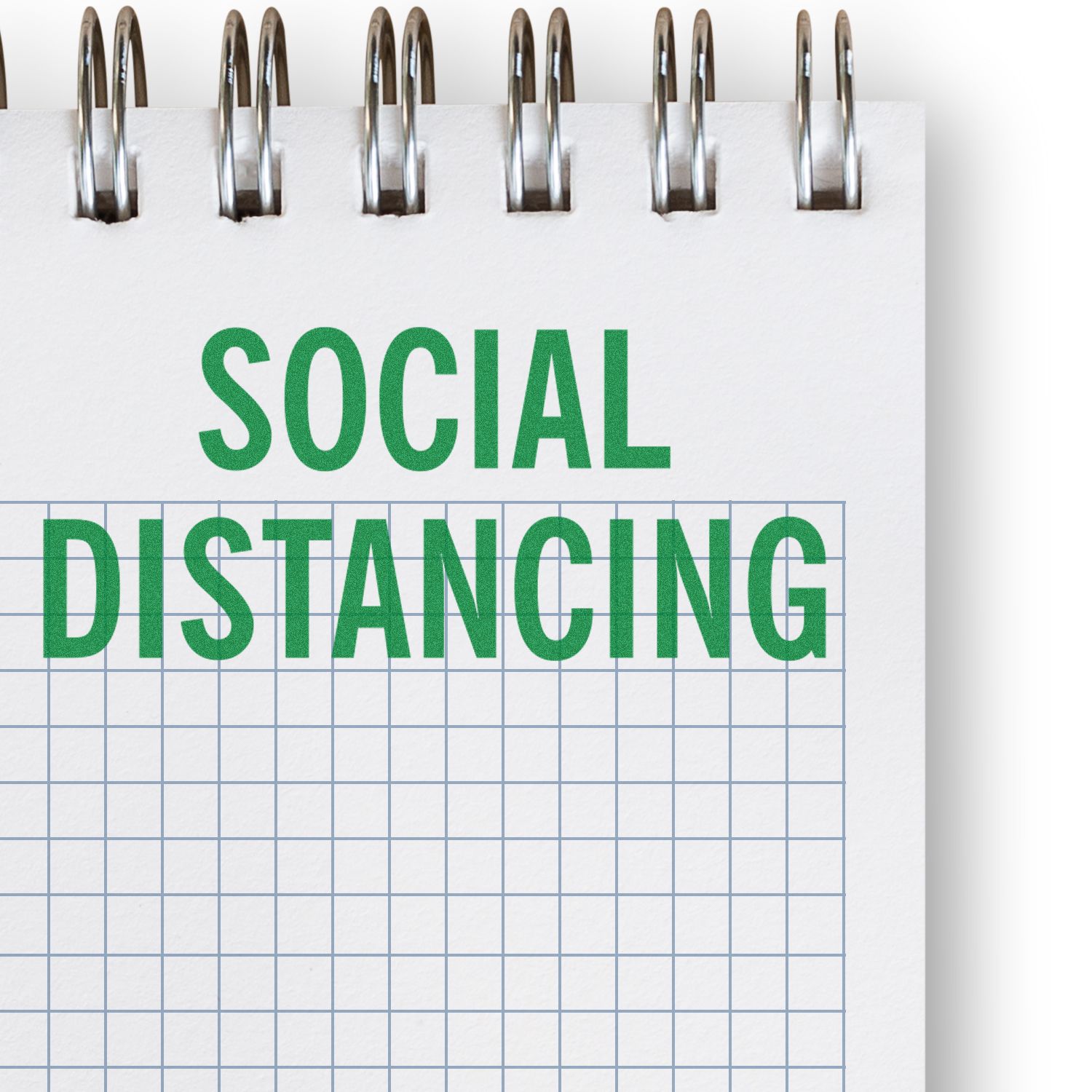 Spiral notebook with Social Distancing text, illustrating COVID-19 safety and public health guidance.
