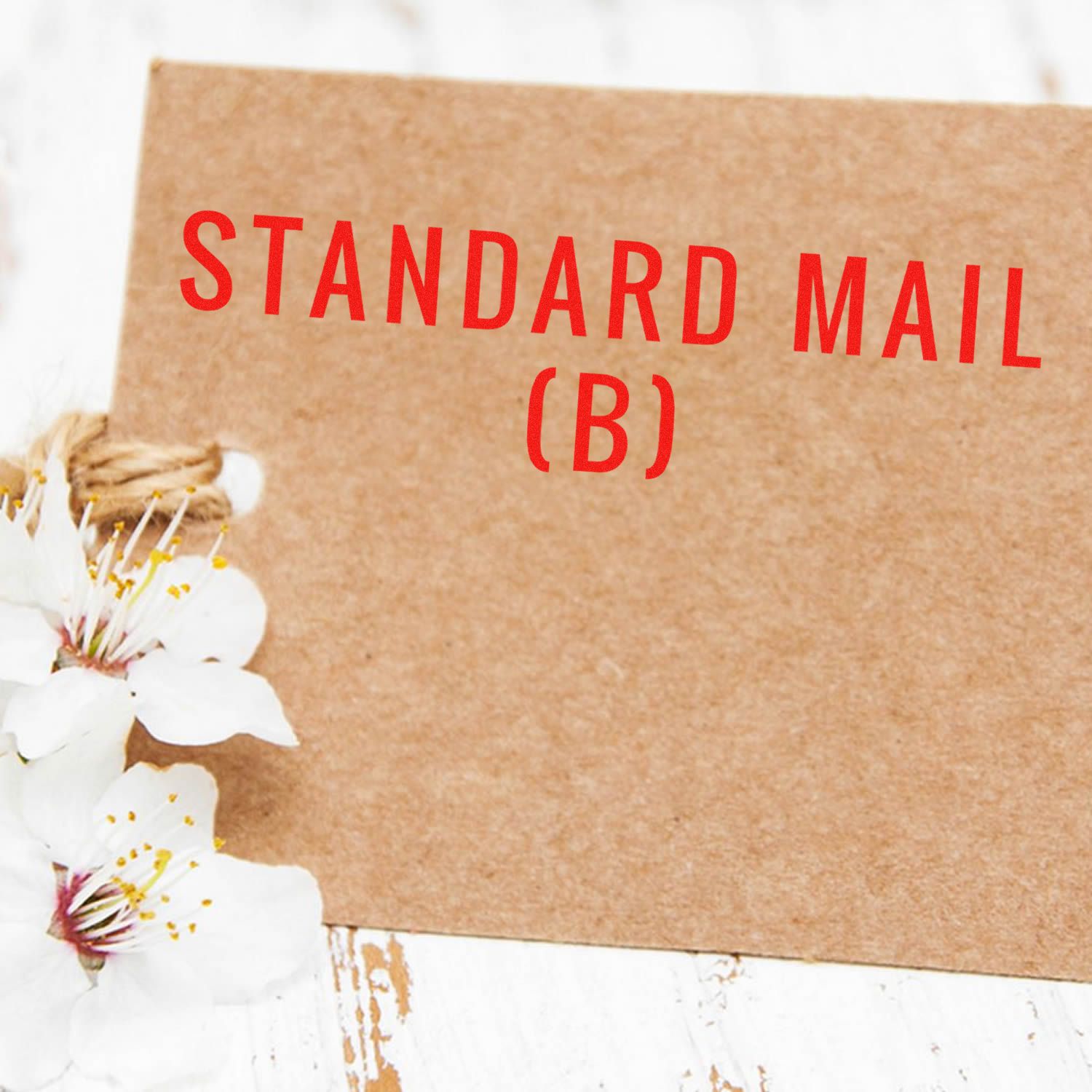 Standard Mail (B) message on kraft paper packaging for USPS postal shipping, with white flowersideal for letters and bulk mail.