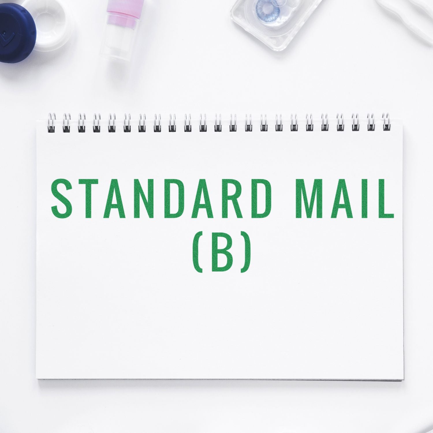 White notebook labeled Standard Mail (B), used for organized mailing supplies, postal forms, and label tracking for Standard Mail.