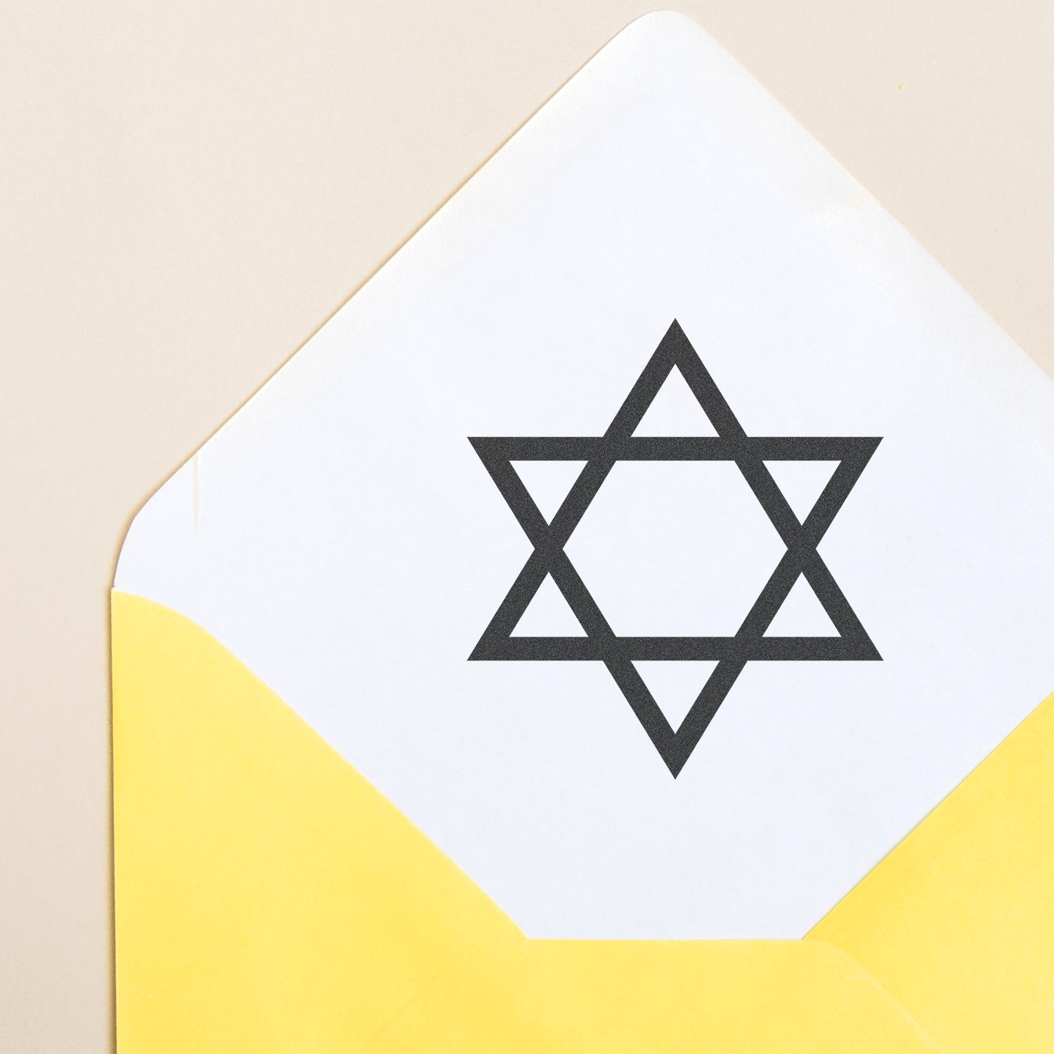 Black Star of David symbol on a white and yellow geometric background, minimalist close-up design.