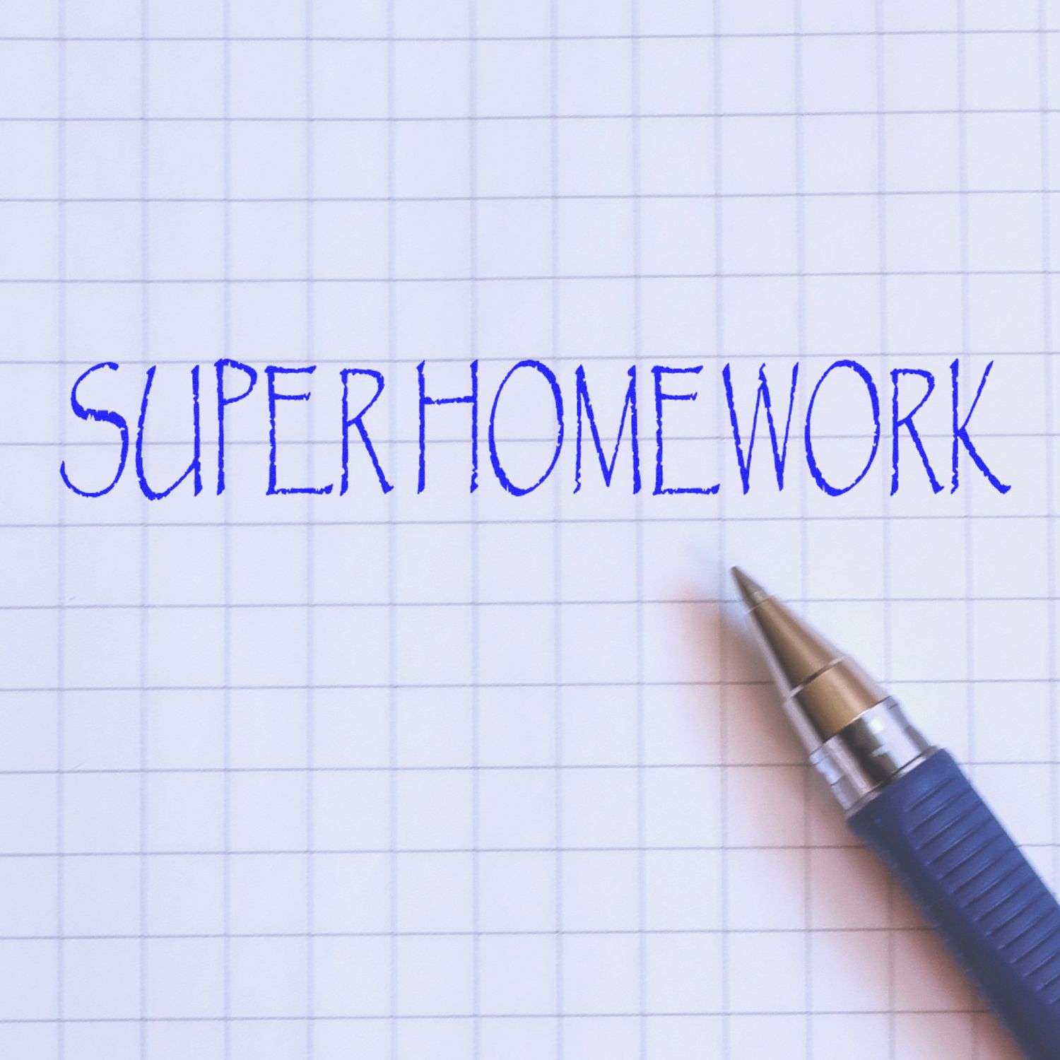 Super Homework handwritten in blue ink on graph paper with a pen on the page.