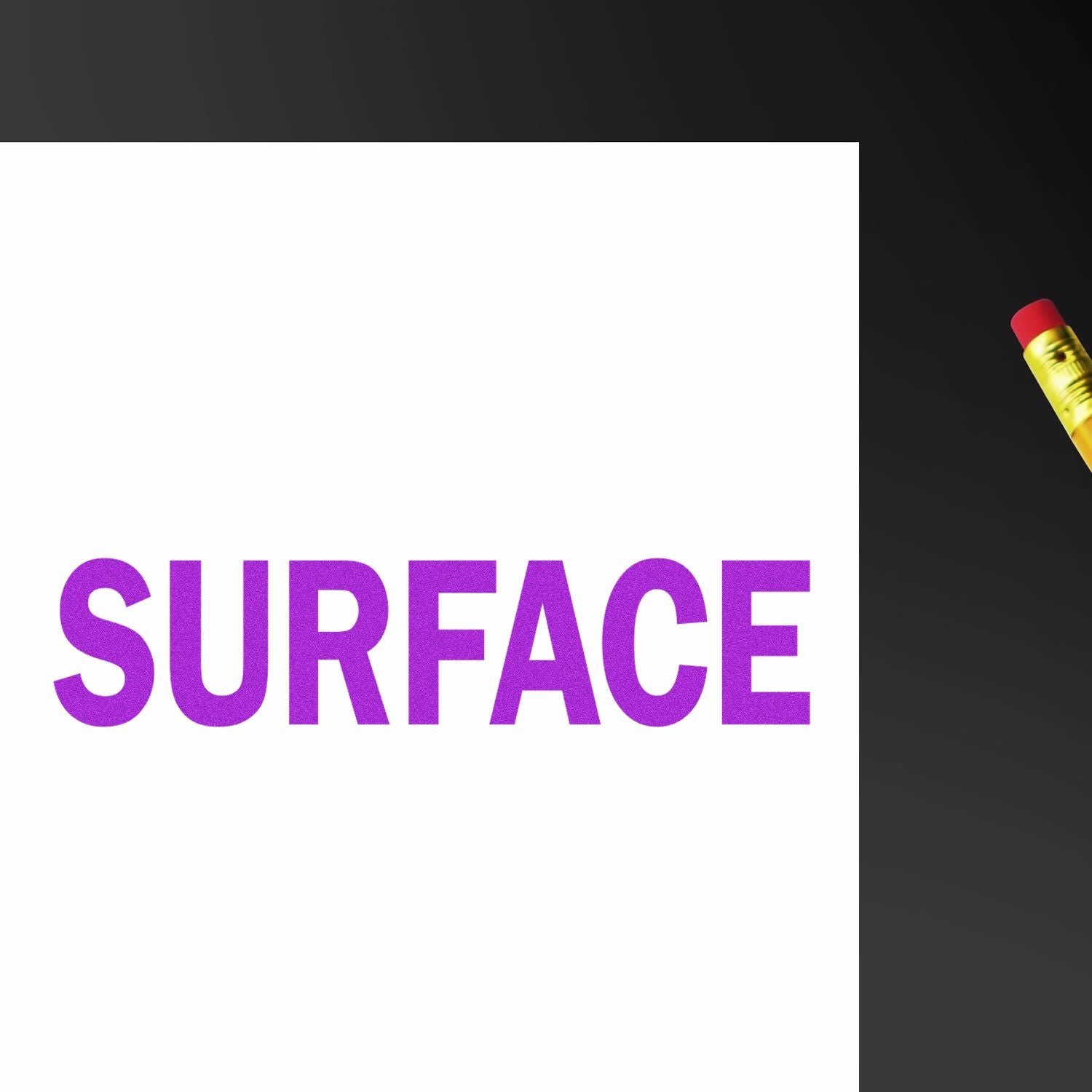 Purple SURFACE text on white paper with a pencil on a black background.