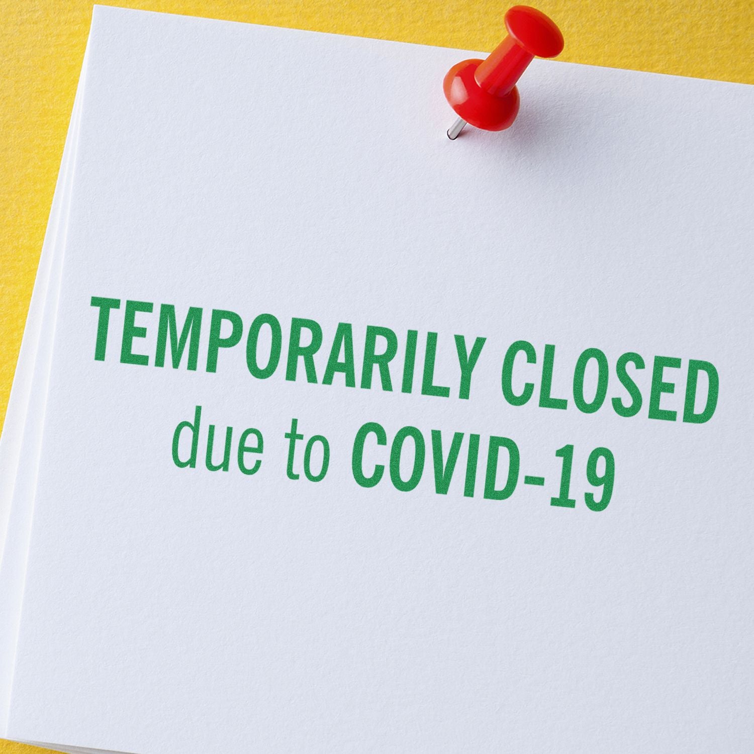 Temporarily closed due to COVID-19 notice pinned on white paper background.