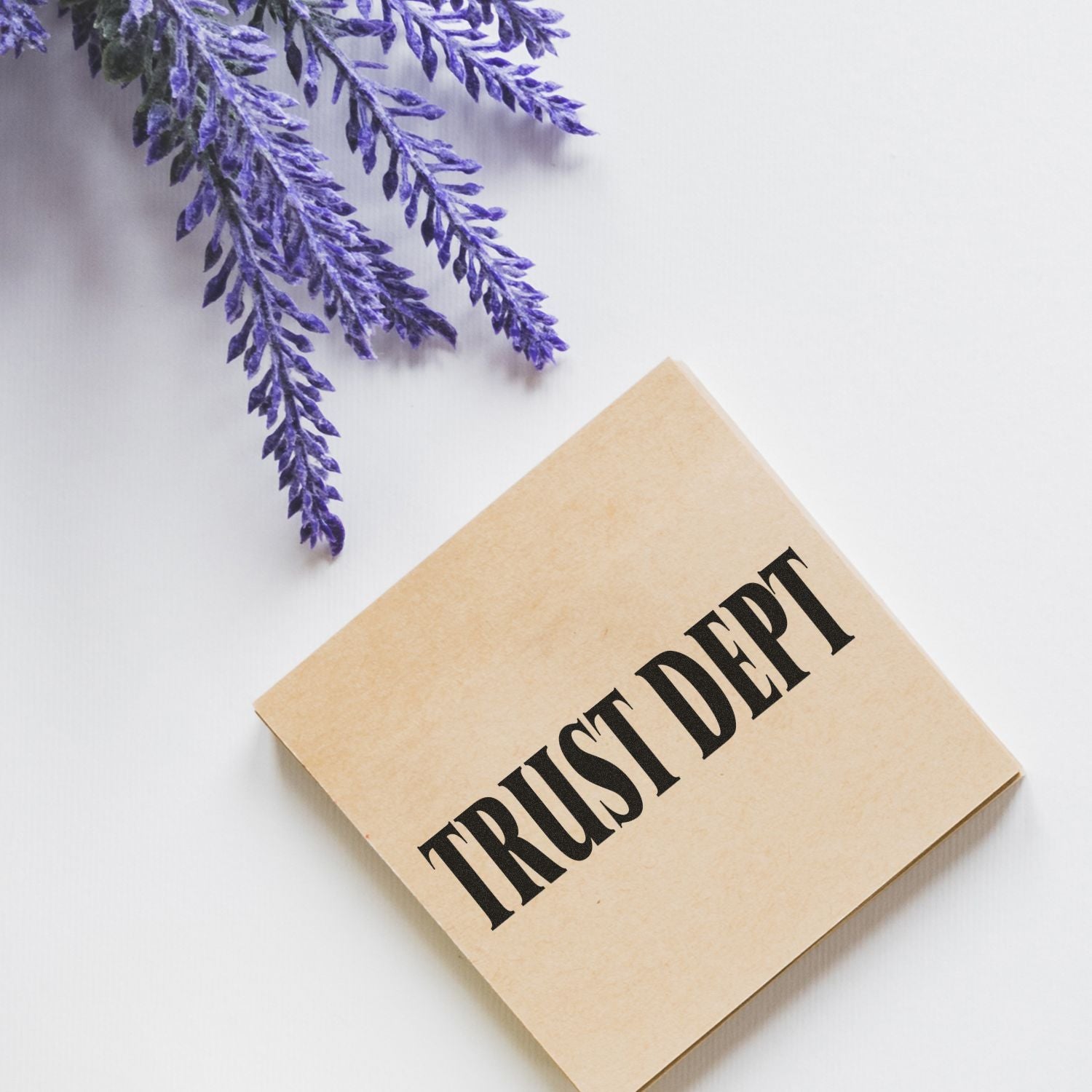 Trust deed document on a white background with purple flowers, legal paperwork flat lay.