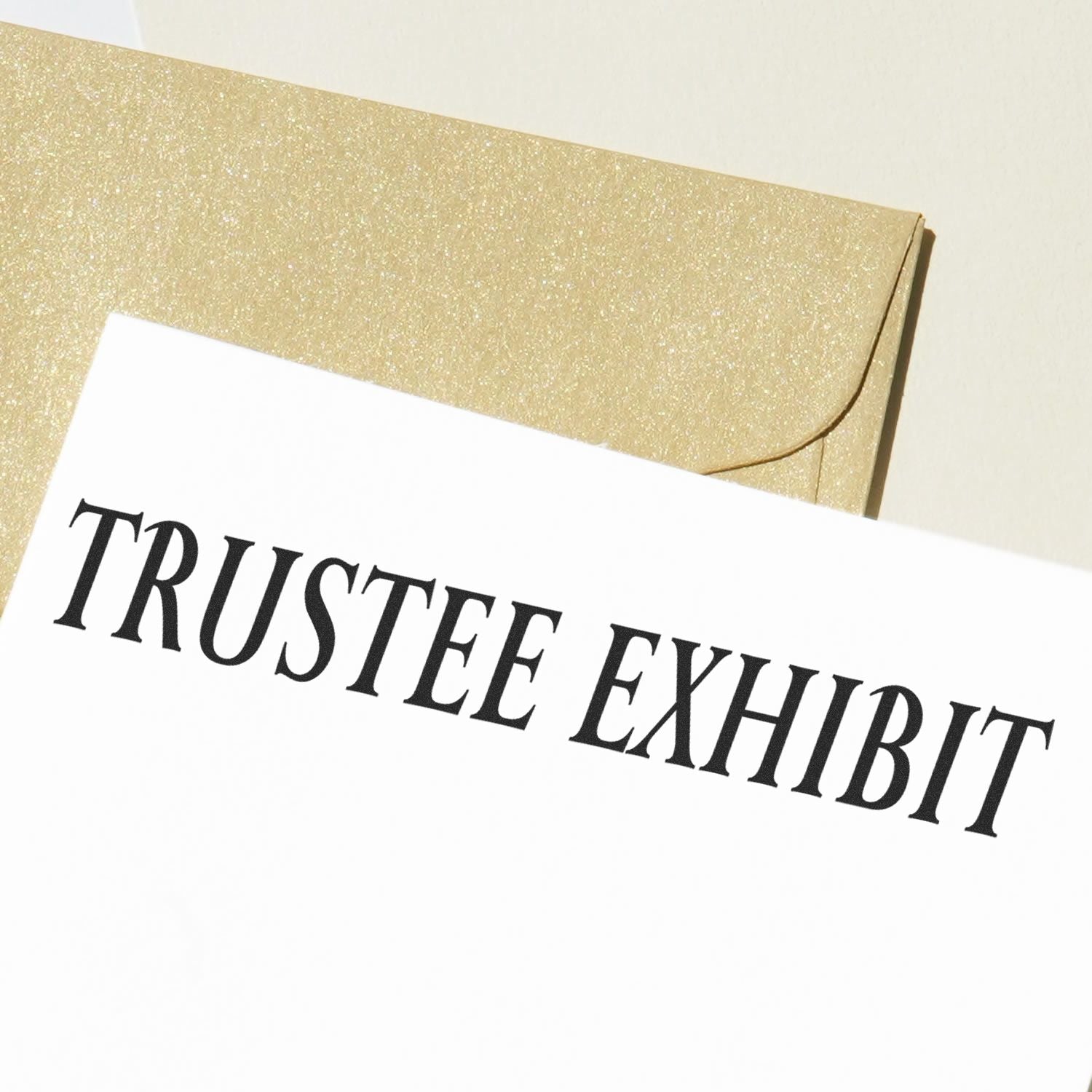 Trustee exhibit document on a gold envelope with elegant black typography.