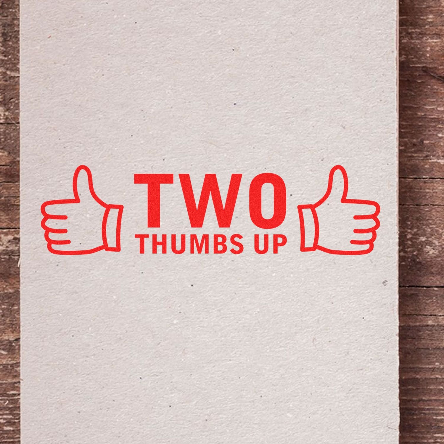 Red Two Thumbs Up graphic with thumbs-up icons on a textured paper background.