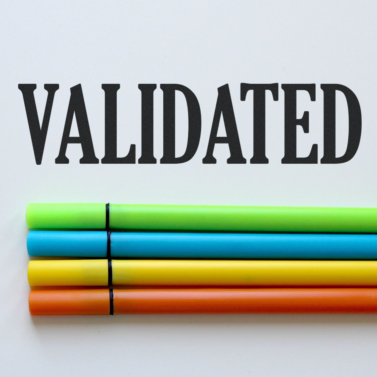 Validated word in bold black letters with colorful markers on white background, symbolizing verified education training and certification.