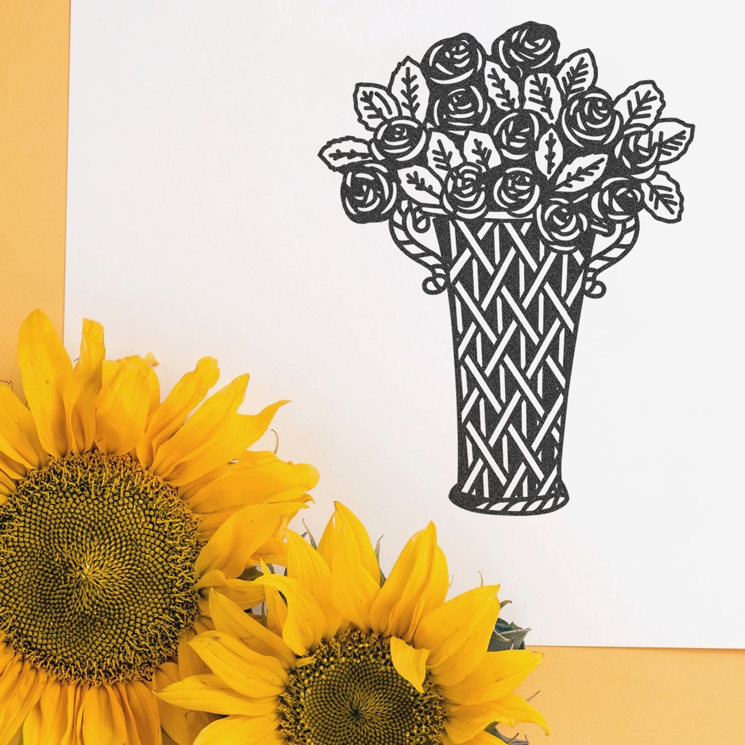 Black floral vase artwork with bright yellow sunflowers on a white background.