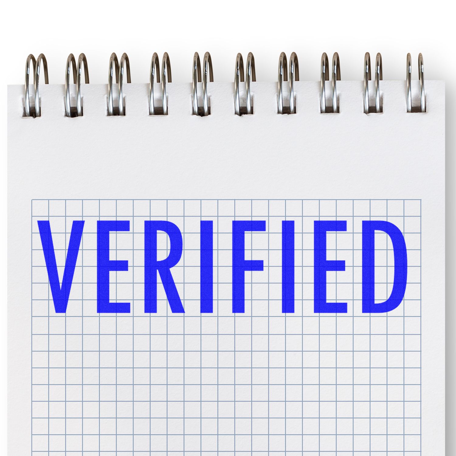 Verified status label on blue text over grid paper with binder clips, representing document verification and online authentication.