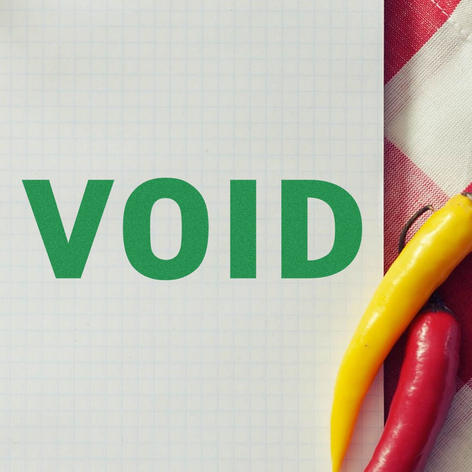 Green VOID text on graph paper with colorful chili peppers on the side