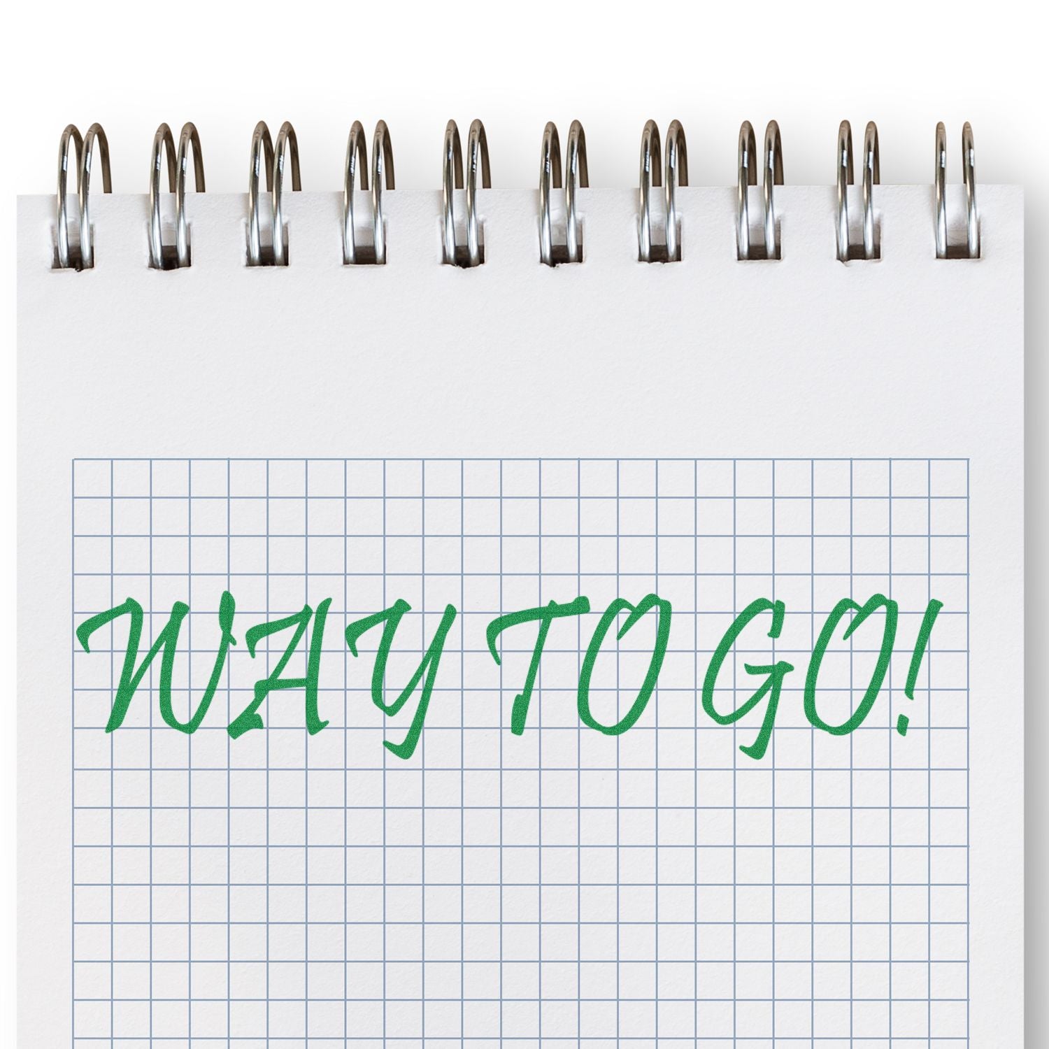 Spiral notebook page with green Way to Go! handwritten on graph paper, celebrating success and achievement.