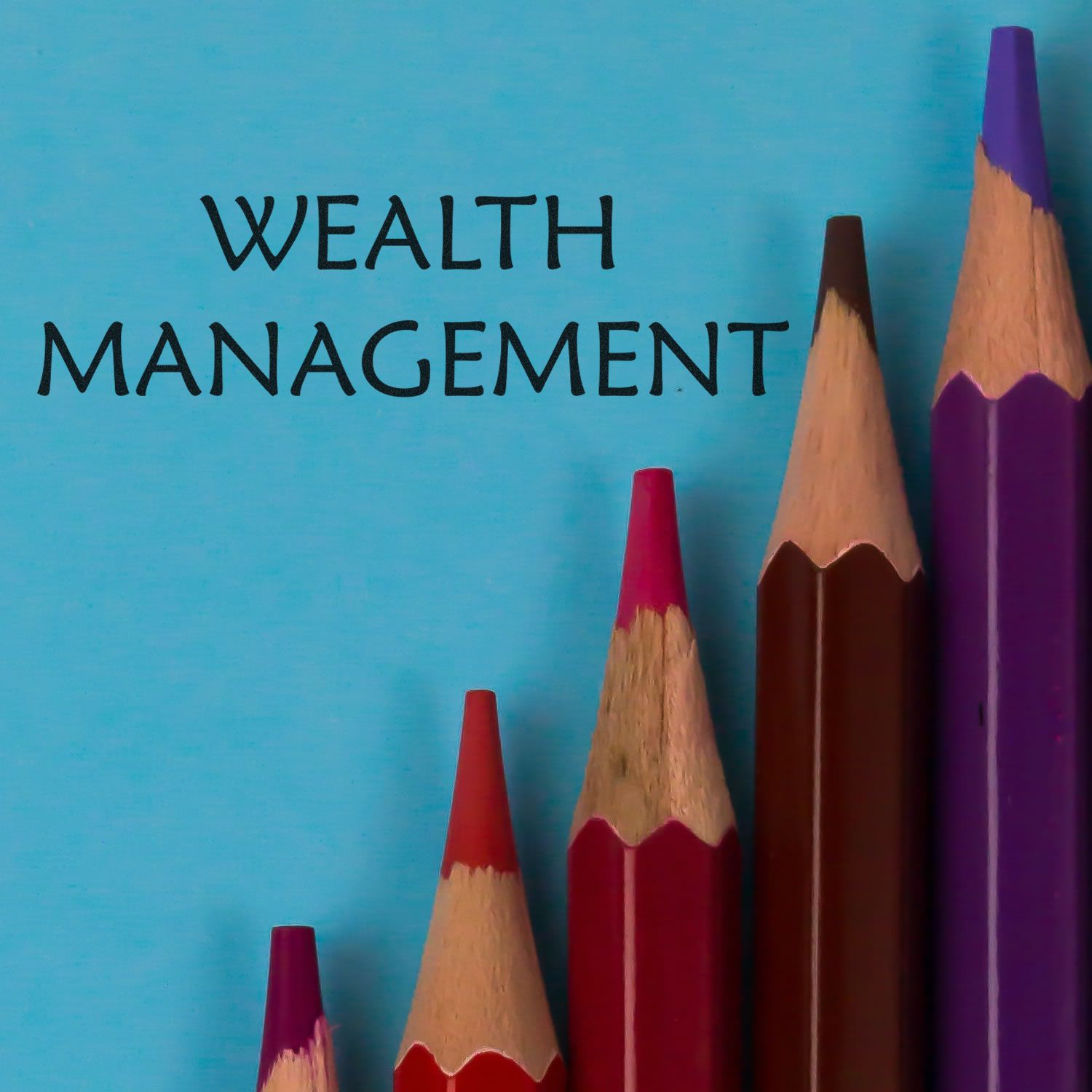 Wealth management concept with colorful pencils and the words WEALTH MANAGEMENT on a blue background.