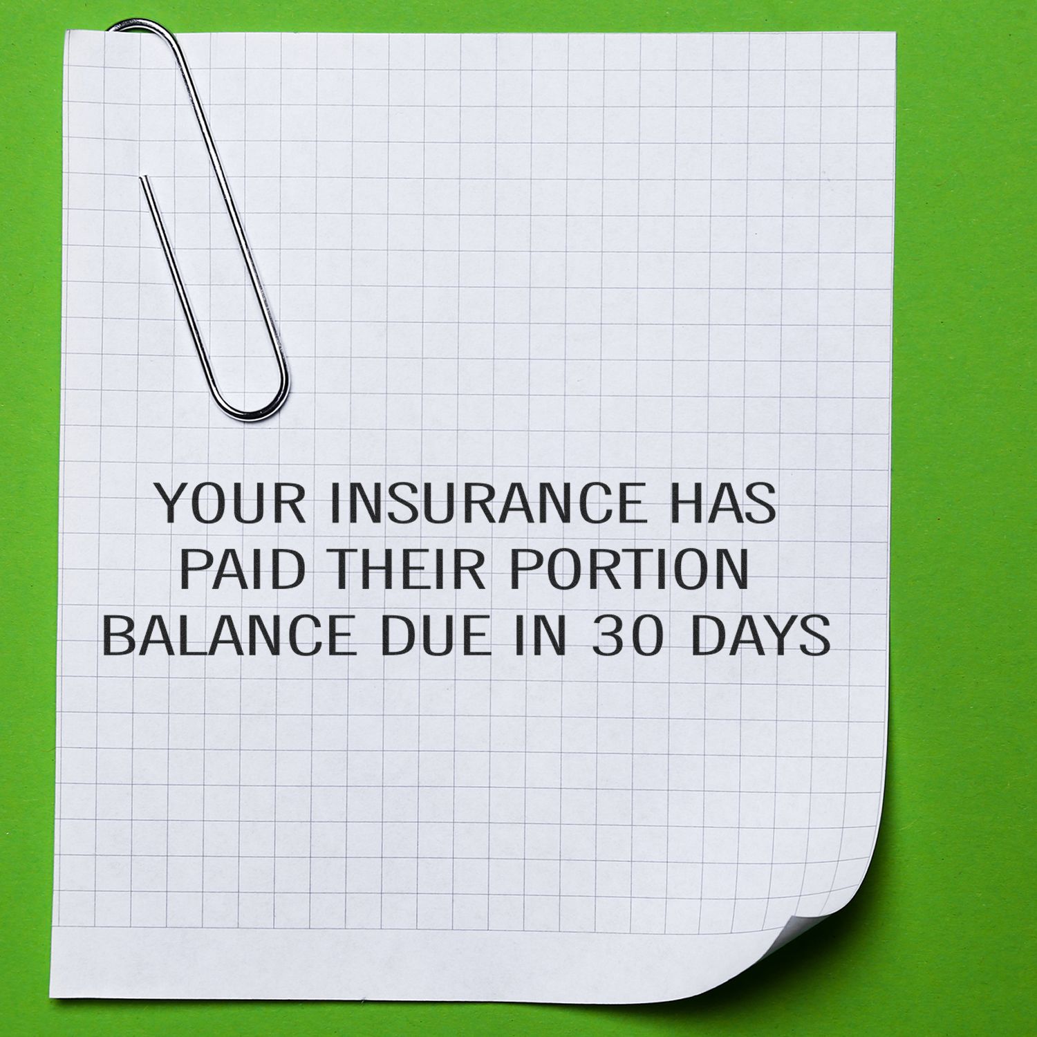 Insurance claim document reminding balance due in 30 days after insurer pays their portion, with paperclip on grid paper.