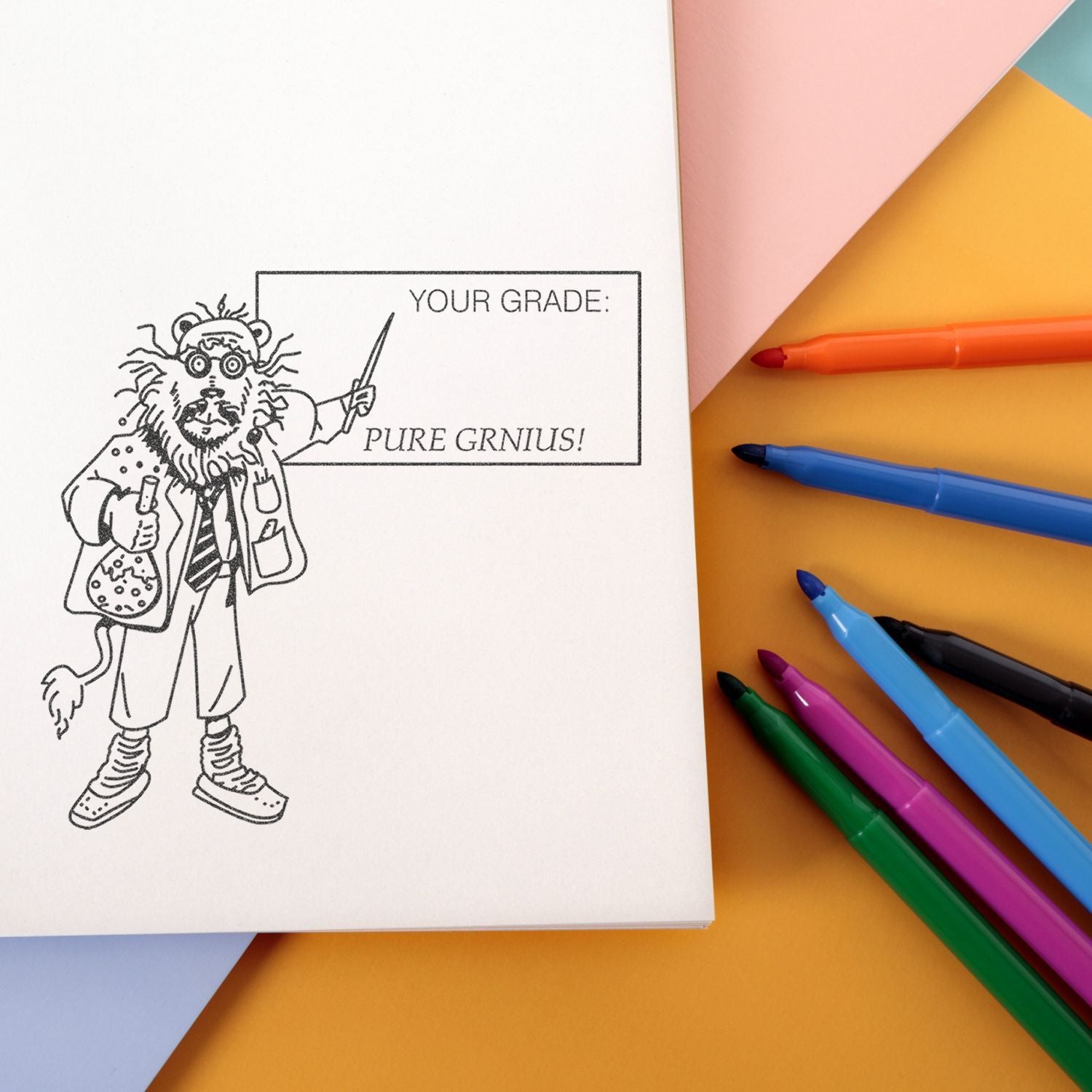 Back to school notebook with funny Pure Genius grade stamp and colorful markers on pastel background.
