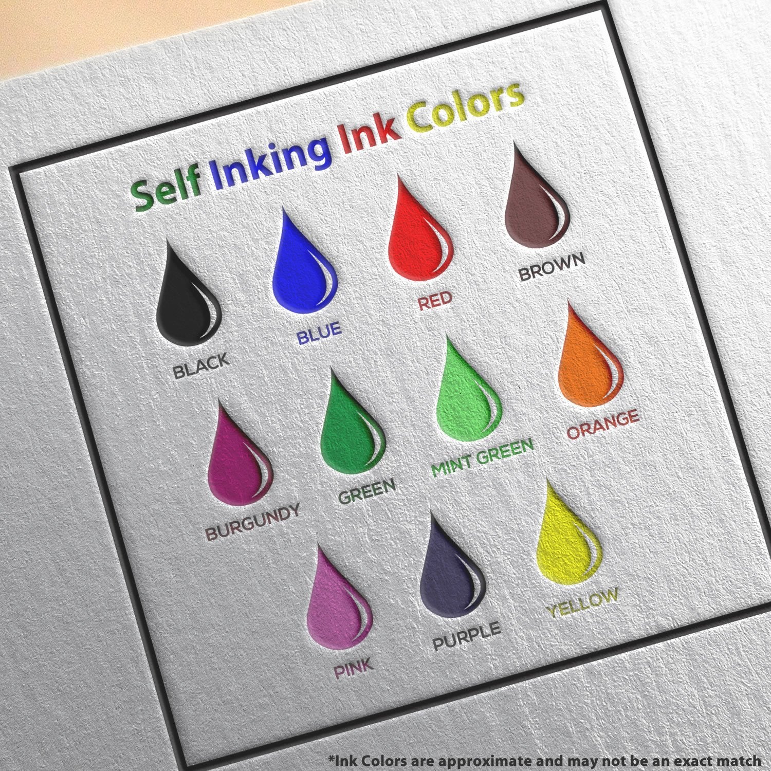 Self-inking stamp ink color chart showing labeled shades: black, blue, green, mint, yellow, purple, pink, red, brown, orange.