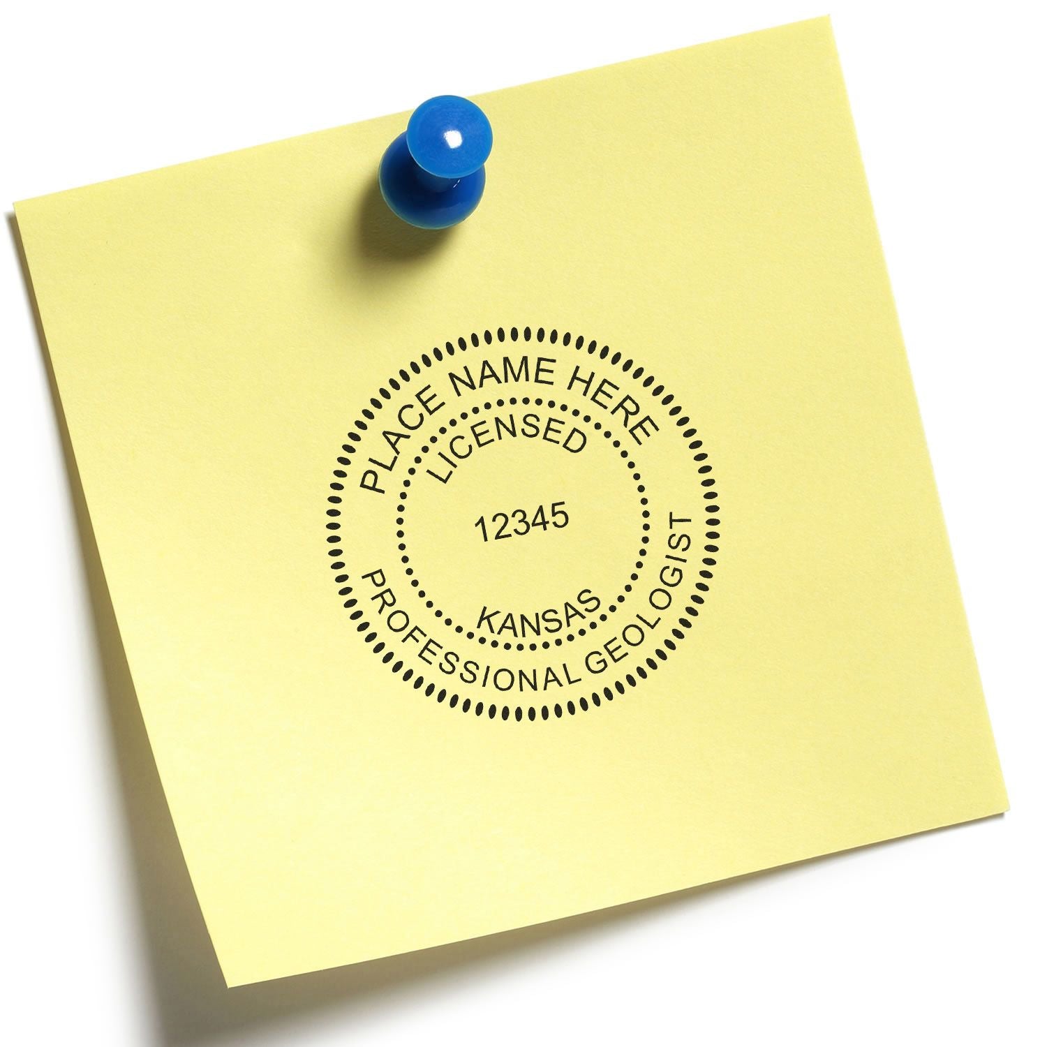 Kansas professional geologist license seal on yellow sticky note pinned with a blue pushpin.