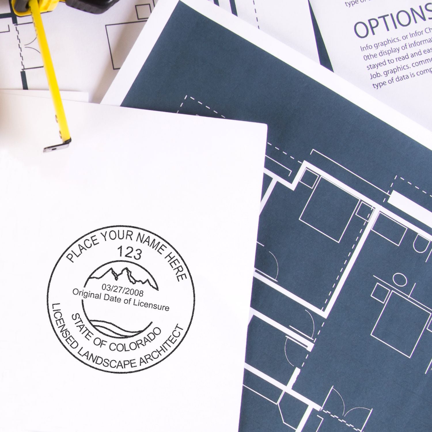 Landscape architect stamp on architectural blueprints and floor plans with drafting pencil and design documents.