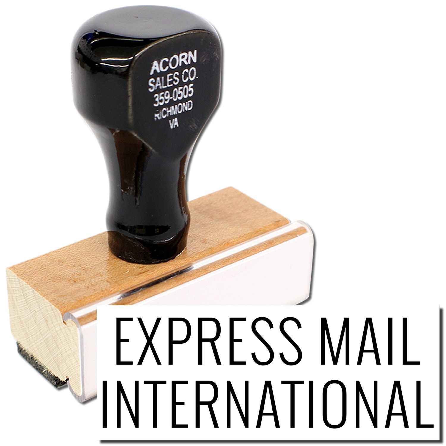 Express Mail International rubber stamp on wooden block, indicating USPS priority shipping and international mailing service.