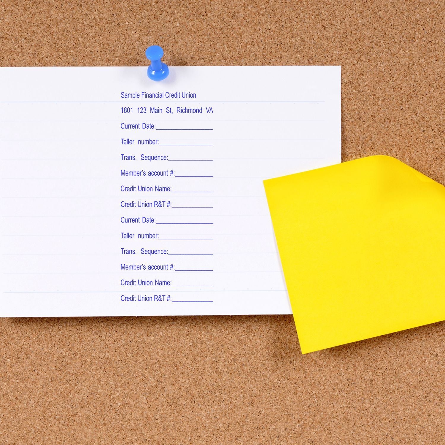Sample Financial Credit Union deposit slip form with member details and fields on corkboard, pinned with a blue pushpin.