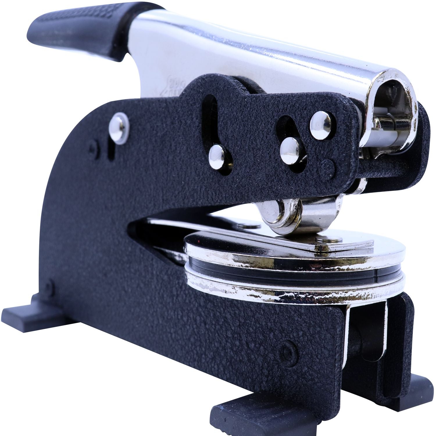 Close-up of a manual button maker press machine with metal lever and badge-making die on a white background.