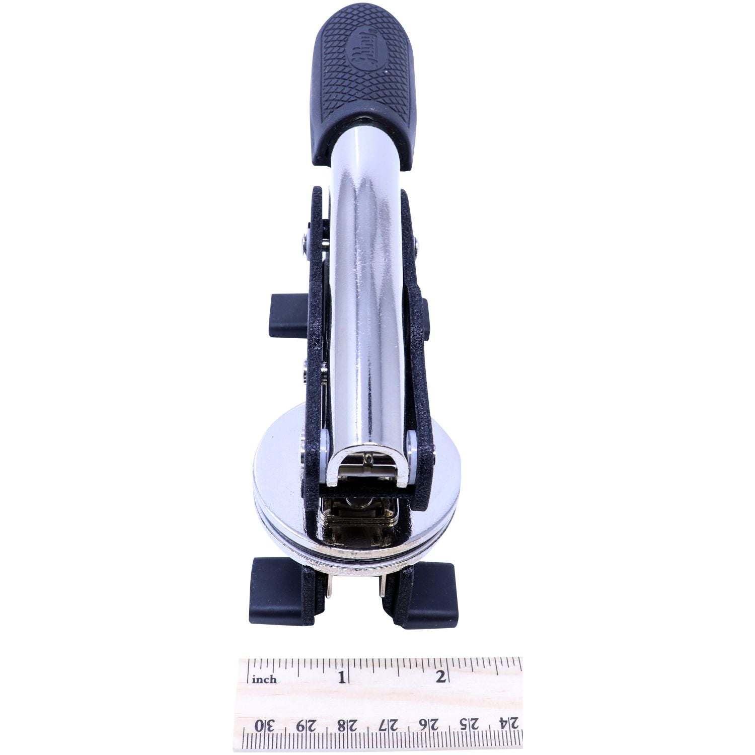 Chrome metal single-hole paper punch with black handle on a white background, shown with ruler for size reference.