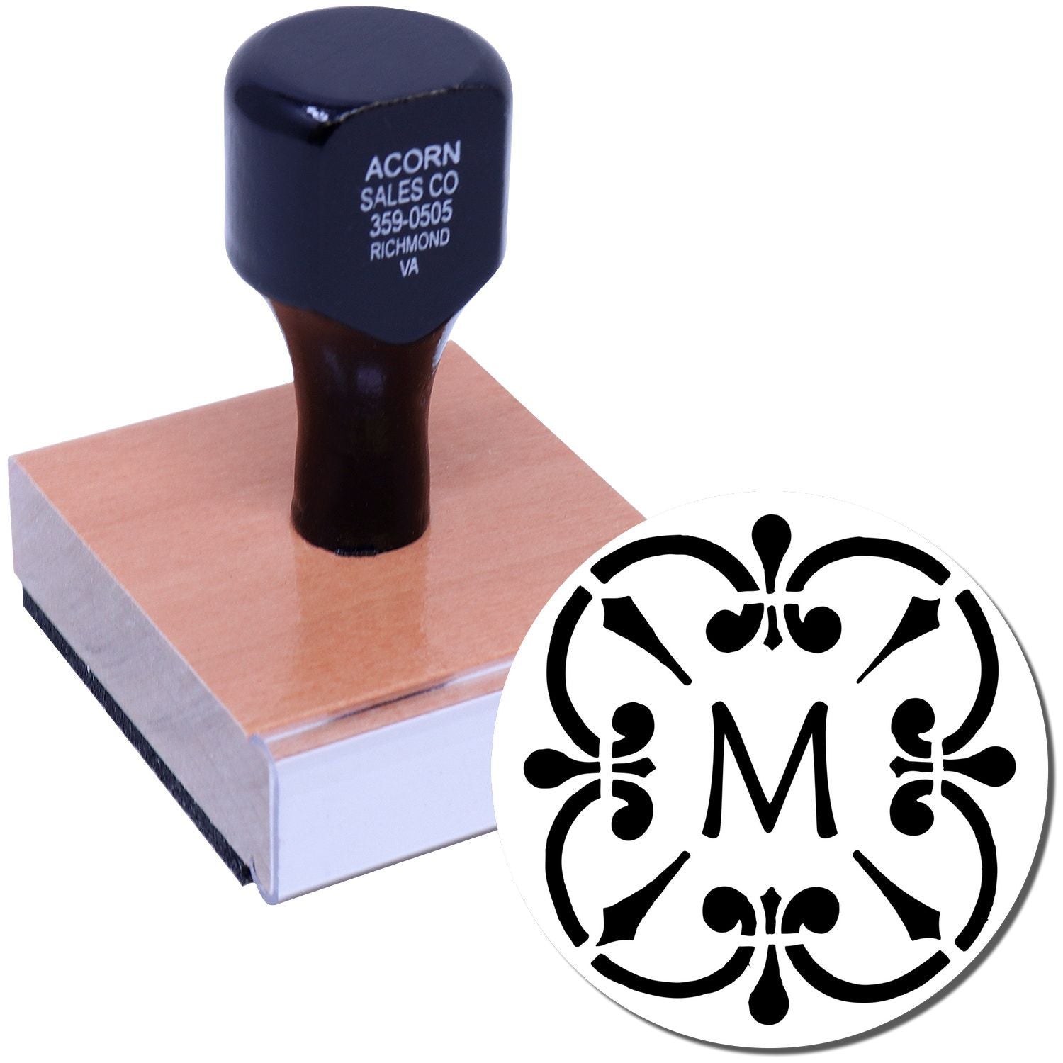 Custom monogram rubber stamp with decorative M design on wooden base for personalized stationery and wedding branding